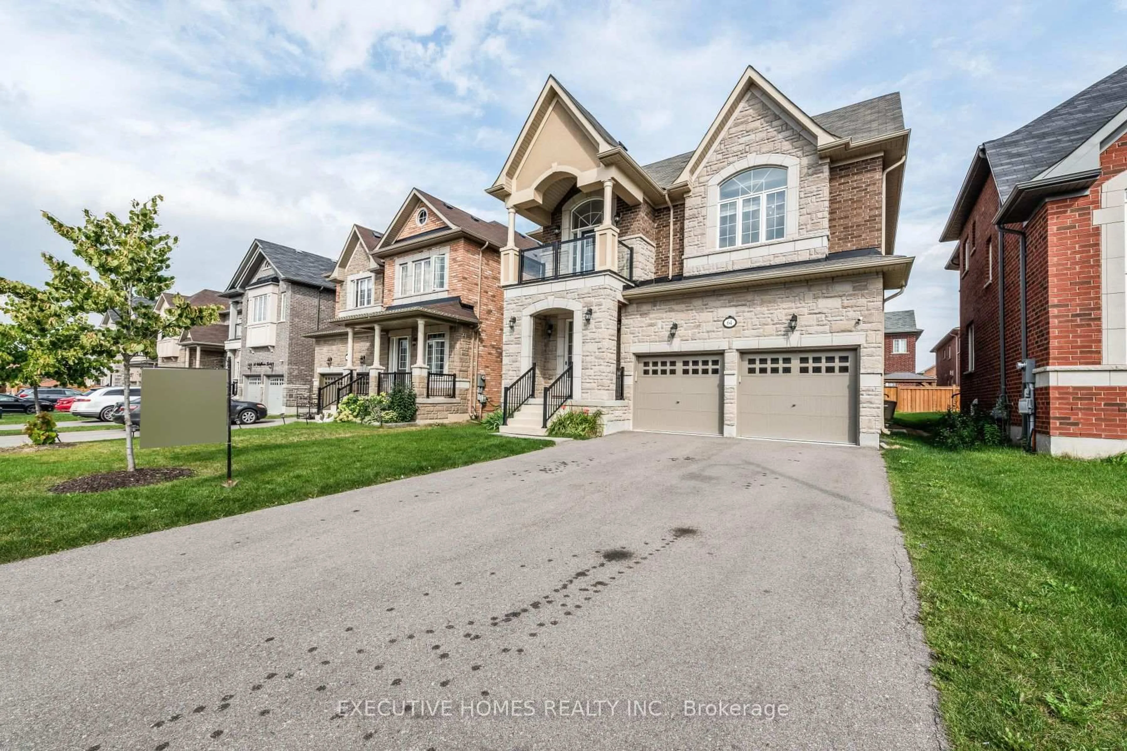 Home with brick exterior material, street for 64 Wildflower Lane, Halton Hills Ontario L7G 0M5