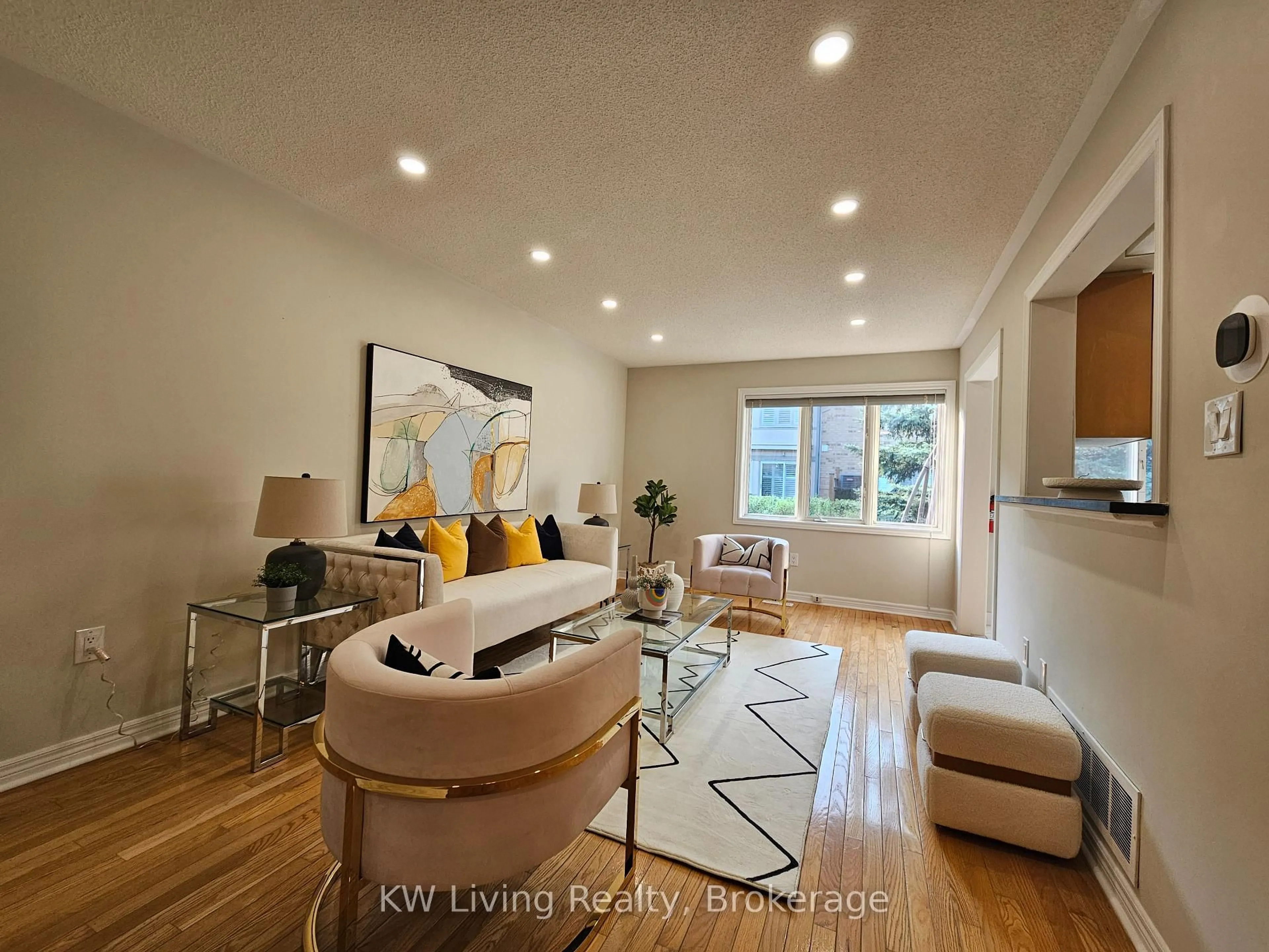 Living room with furniture, wood/laminate floor for 5662 Glen Erin Dr #56, Mississauga Ontario L5M 5J2