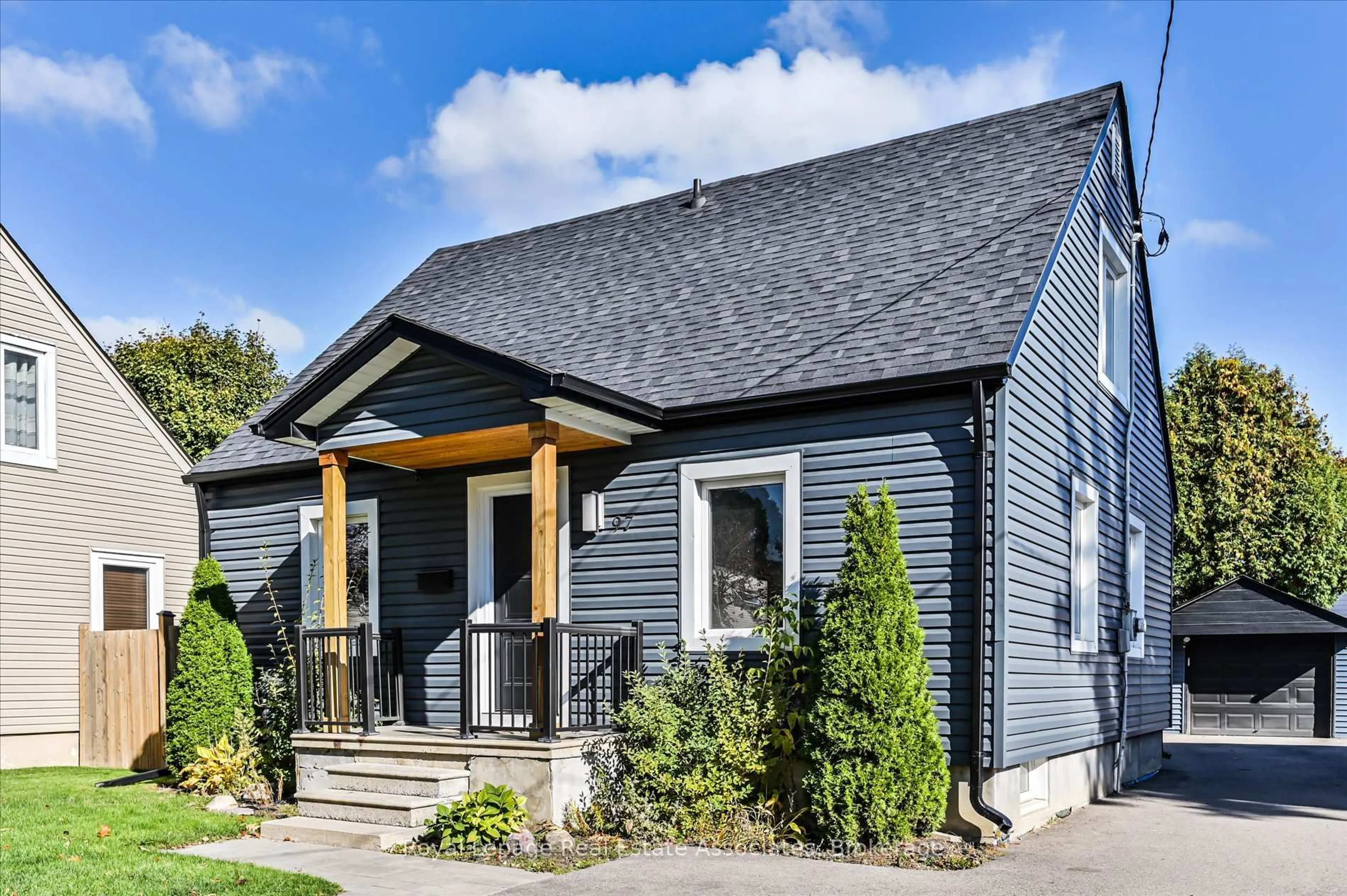 Home with vinyl exterior material, street for 97 Hearst Circ, Toronto Ontario M6M 2V3