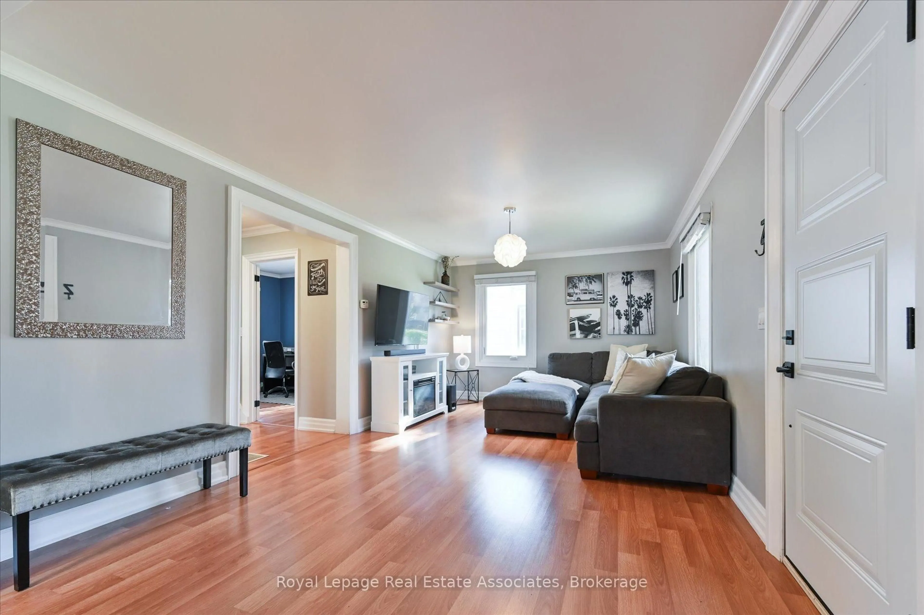 Living room with furniture, wood/laminate floor for 97 Hearst Circ, Toronto Ontario M6M 2V3