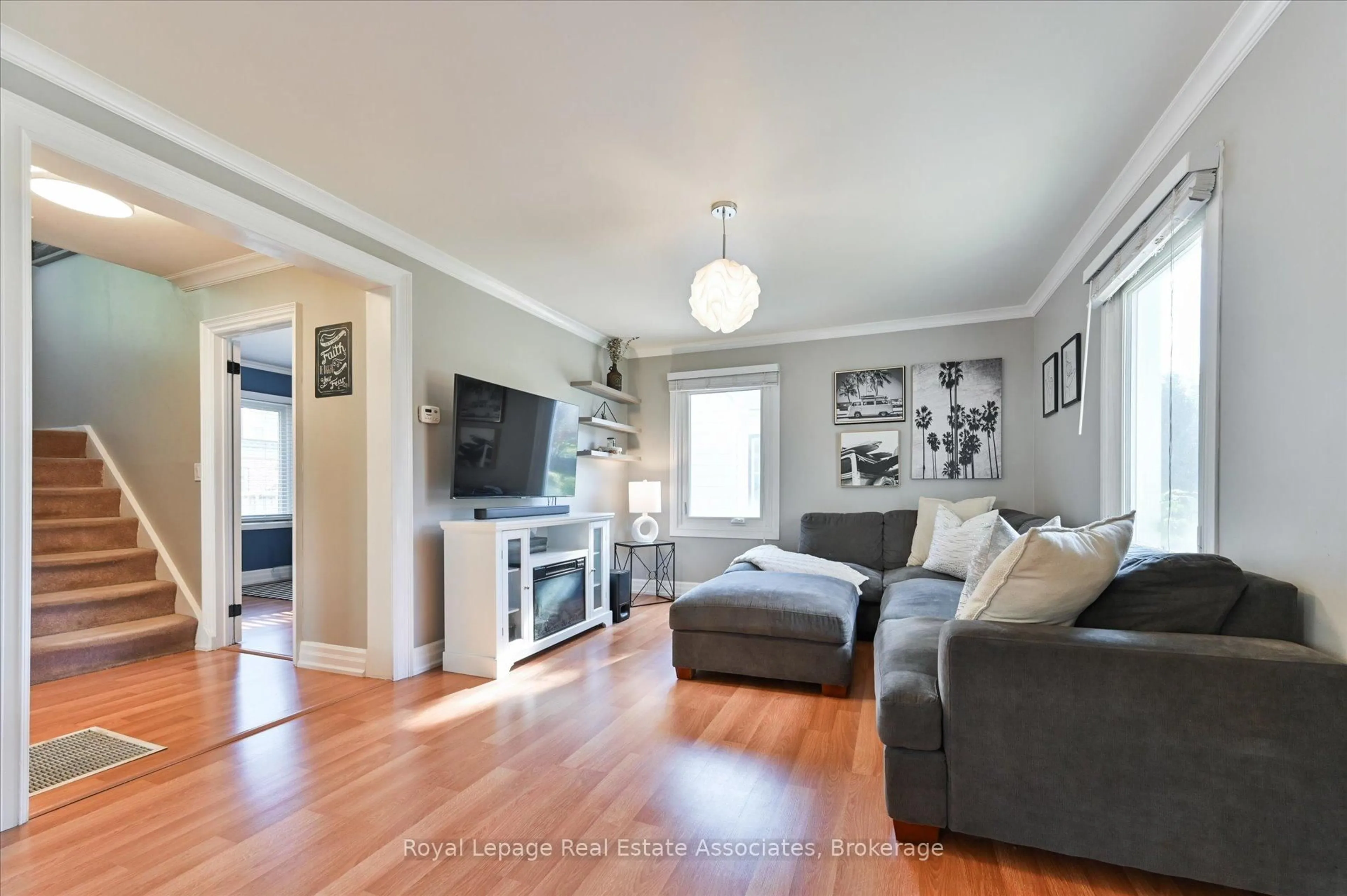 Living room with furniture, wood/laminate floor for 97 Hearst Circ, Toronto Ontario M6M 2V3