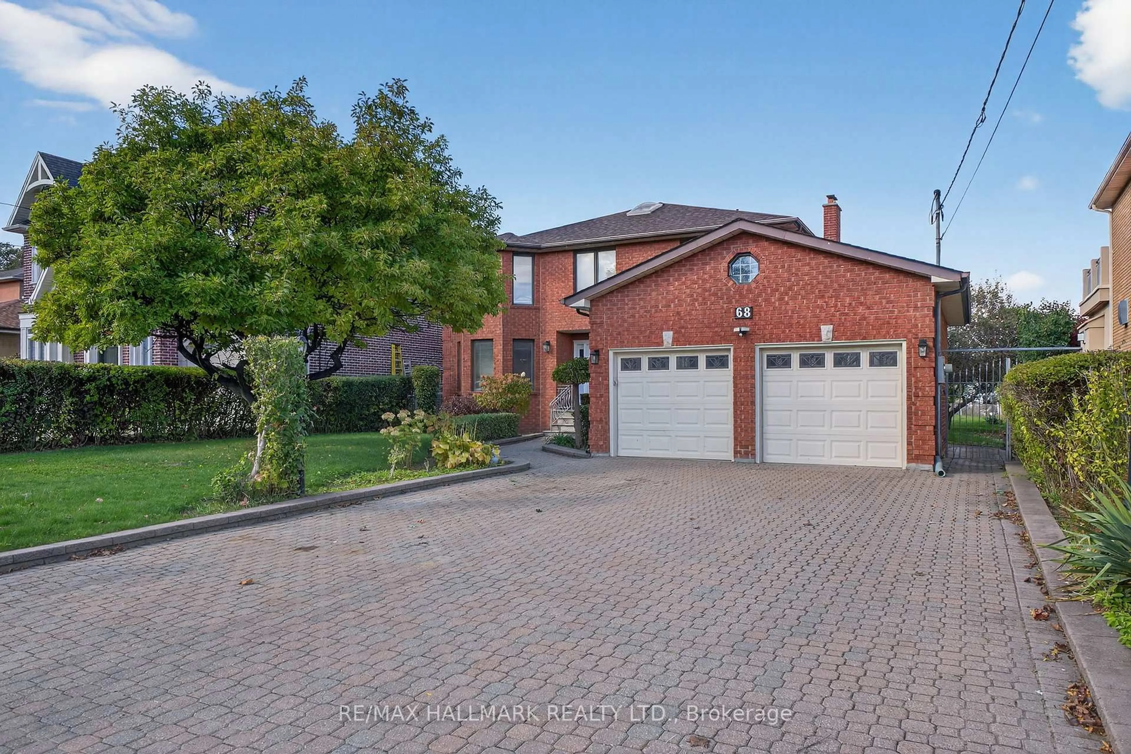 Home with brick exterior material, street for 68 Sunset Tr, Toronto Ontario M9M 1J6