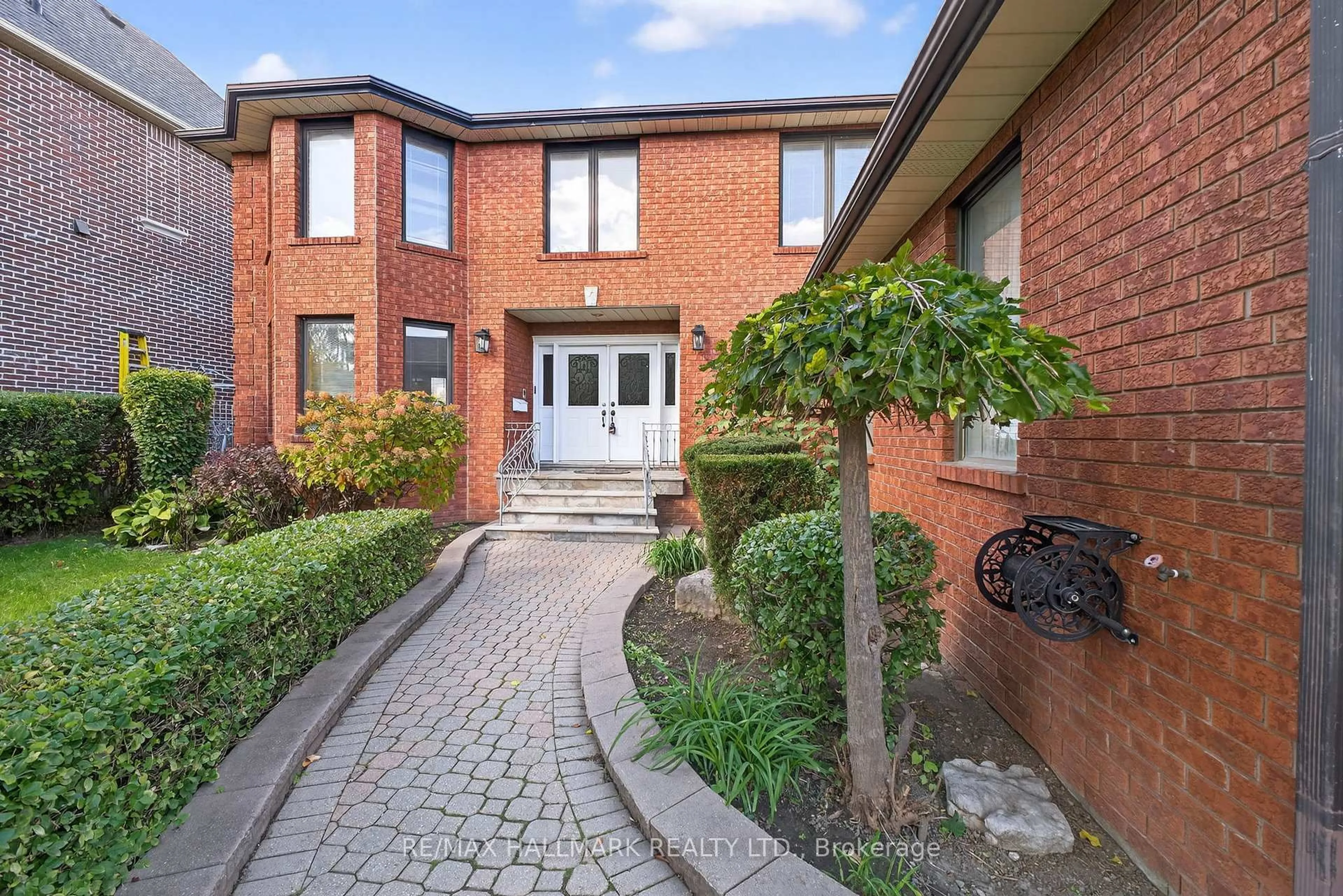 Home with brick exterior material, street for 68 Sunset Tr, Toronto Ontario M9M 1J6