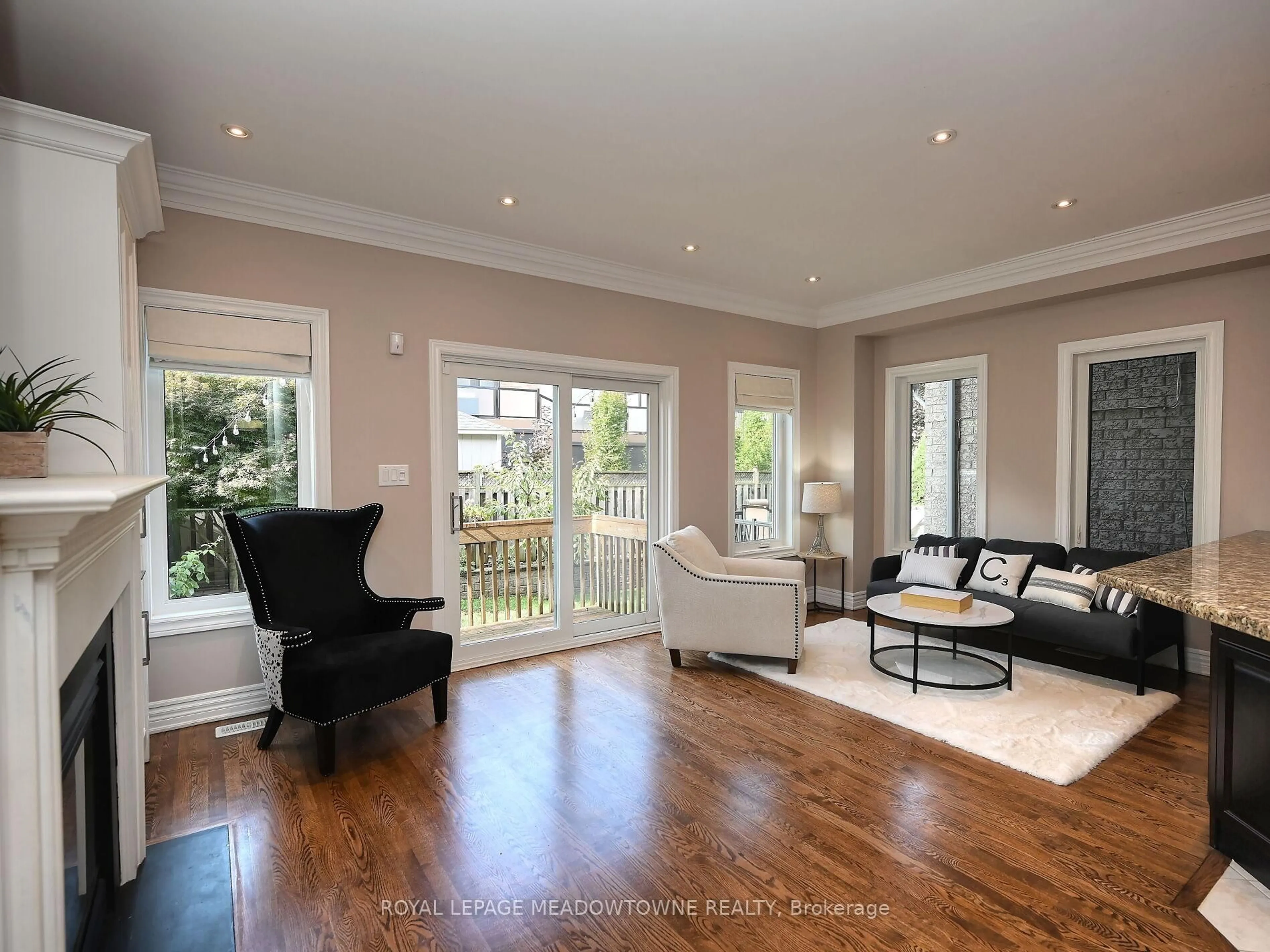 Living room with furniture, wood/laminate floor for 2378 Wasaga Dr, Oakville Ontario L6H 0B7