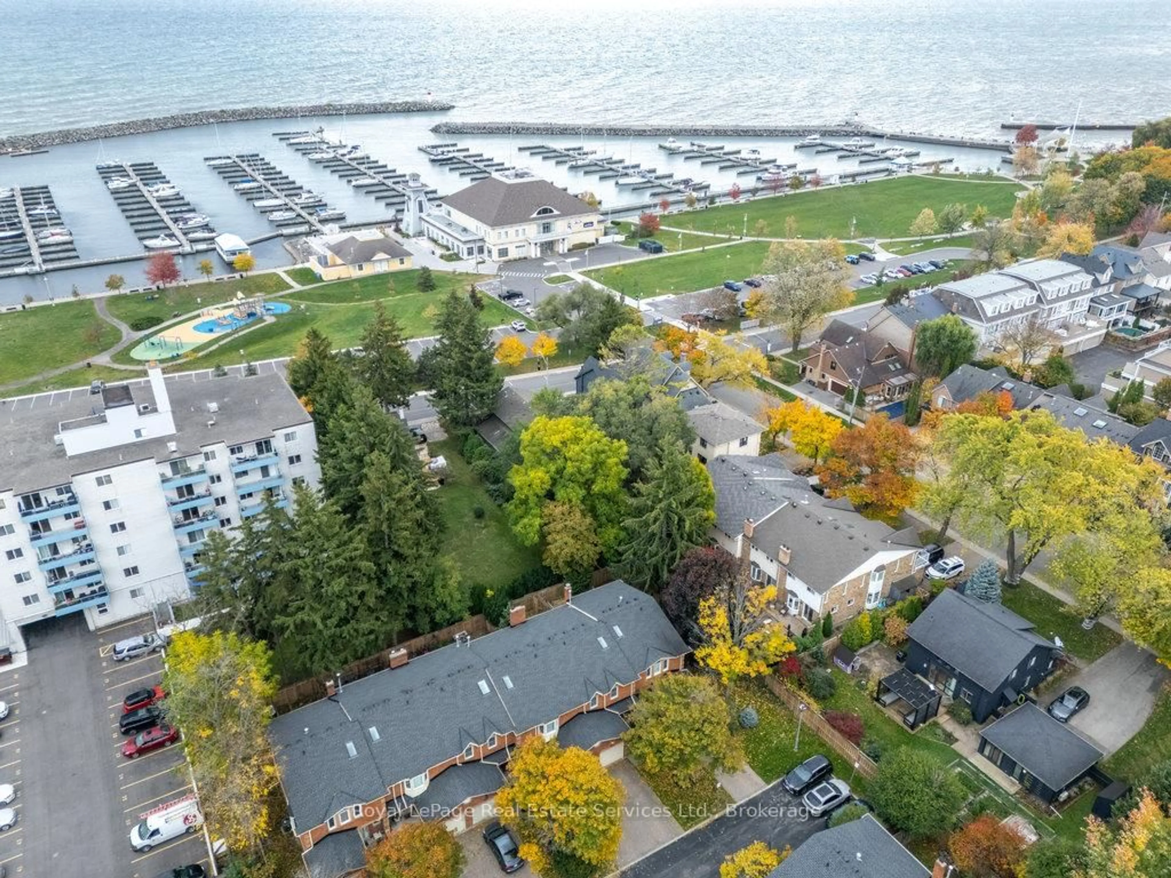 A pic from outside/outdoor area/front of a property/back of a property/a pic from drone, water/lake/river/ocean view for 2318 Marine Dr #2, Oakville Ontario L6L 1C3