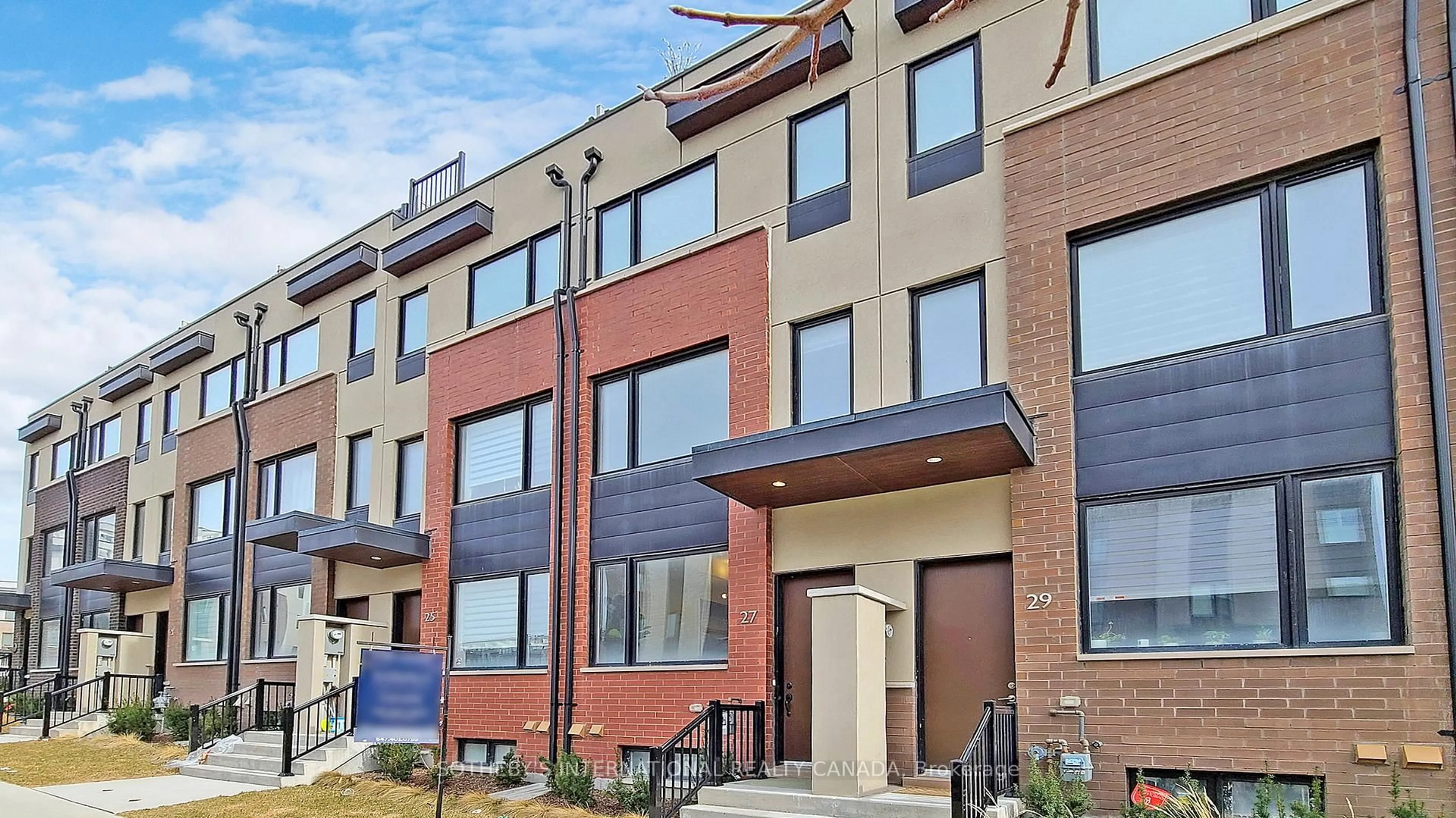 Home with brick exterior material, street for 27 Thomas Mulholland Dr, Toronto Ontario M3K 0A8