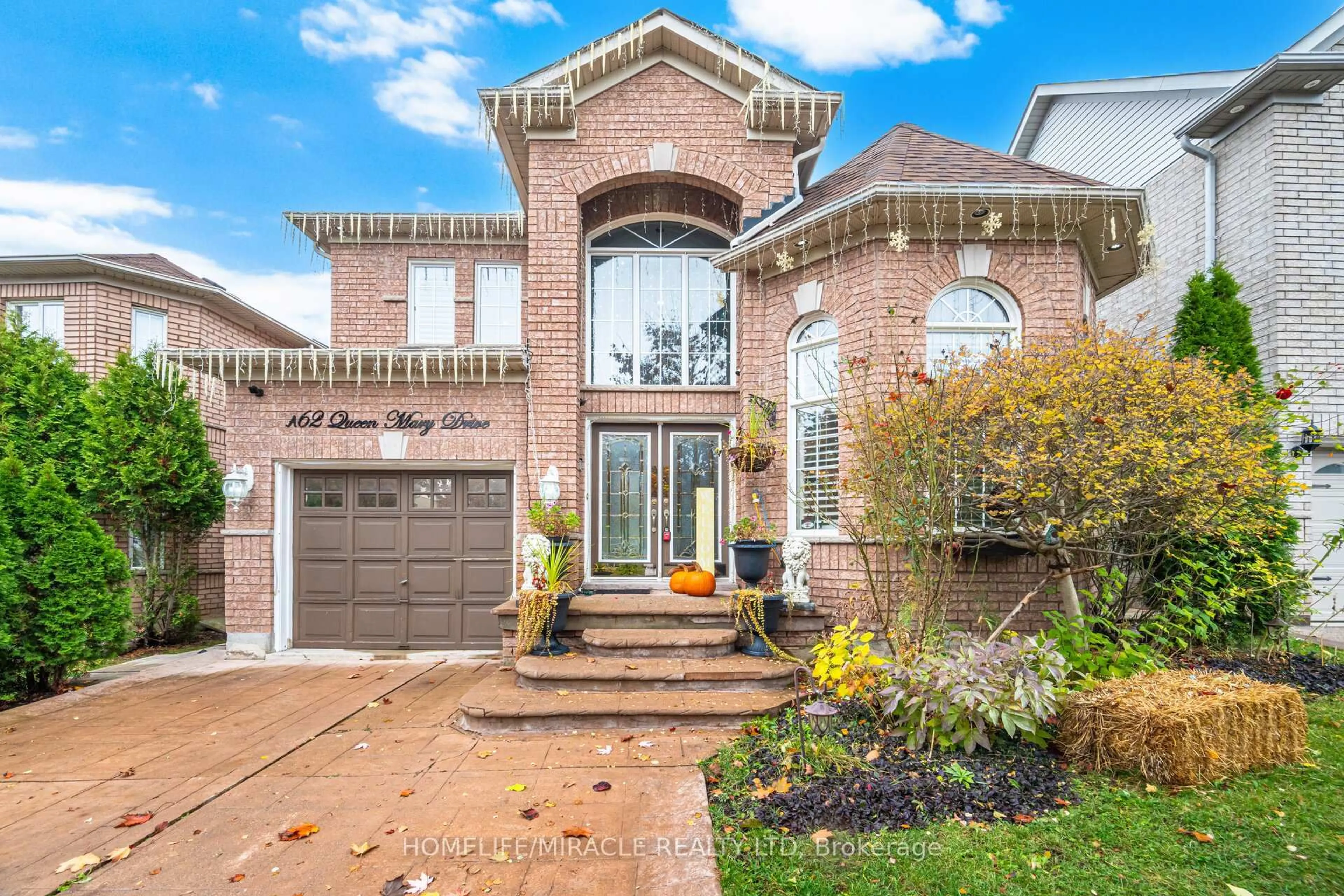 Home with brick exterior material, street for 62 Queen Mary Dr, Brampton Ontario L7A 2K3