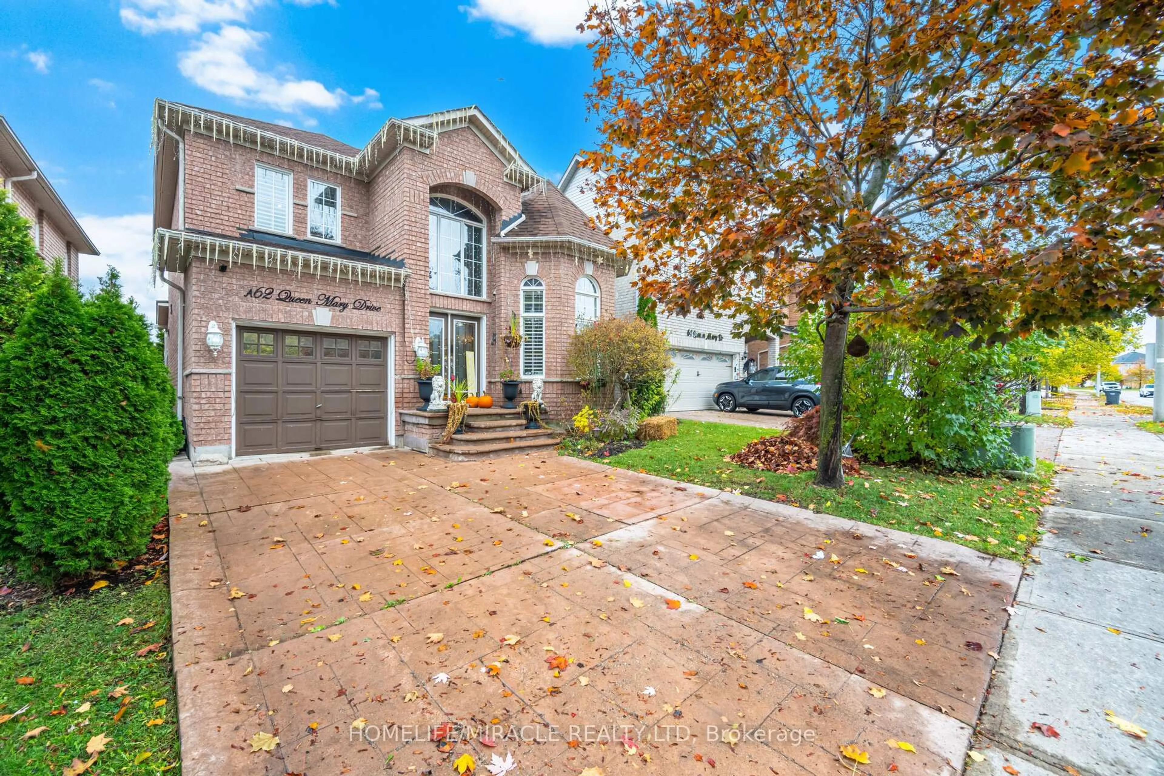 Home with brick exterior material, street for 62 Queen Mary Dr, Brampton Ontario L7A 2K3