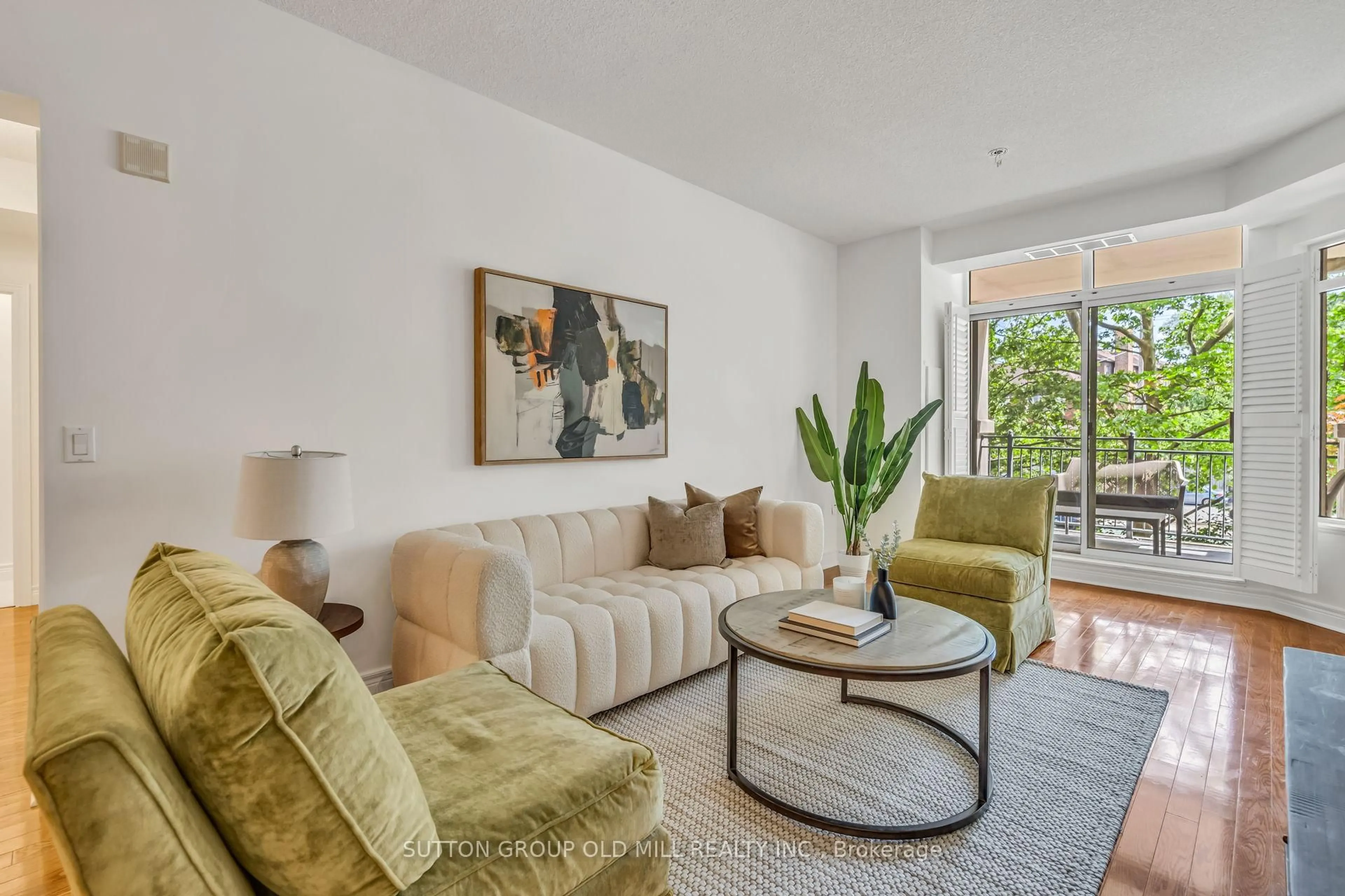 Living room with furniture, unknown for 10 Old Mill Tr #206, Toronto Ontario M8X 2Y9