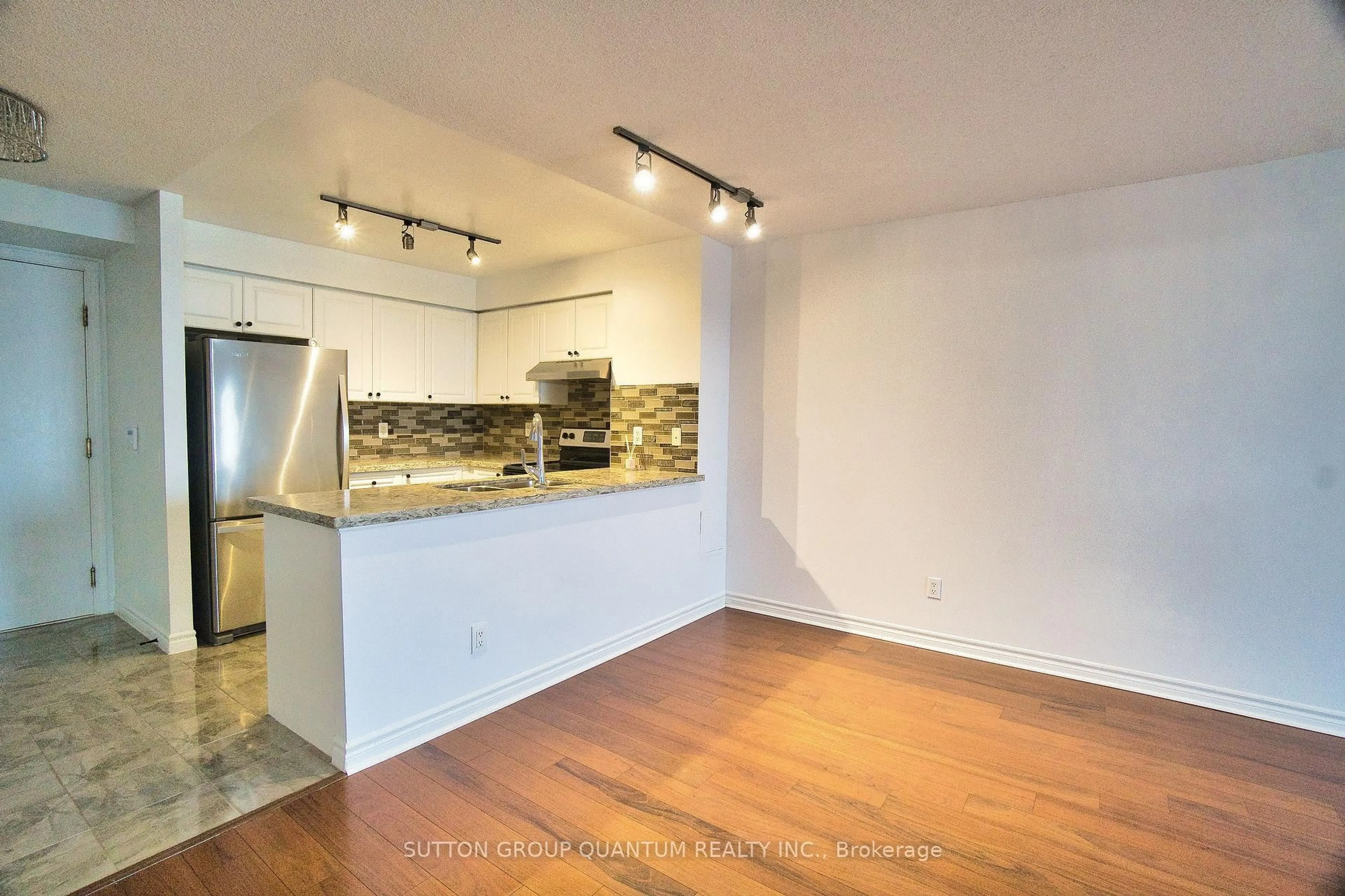 Open concept kitchen, wood/laminate floor for 25 Kingsbridge Garden Circ #716, Mississauga Ontario L5R 4B1