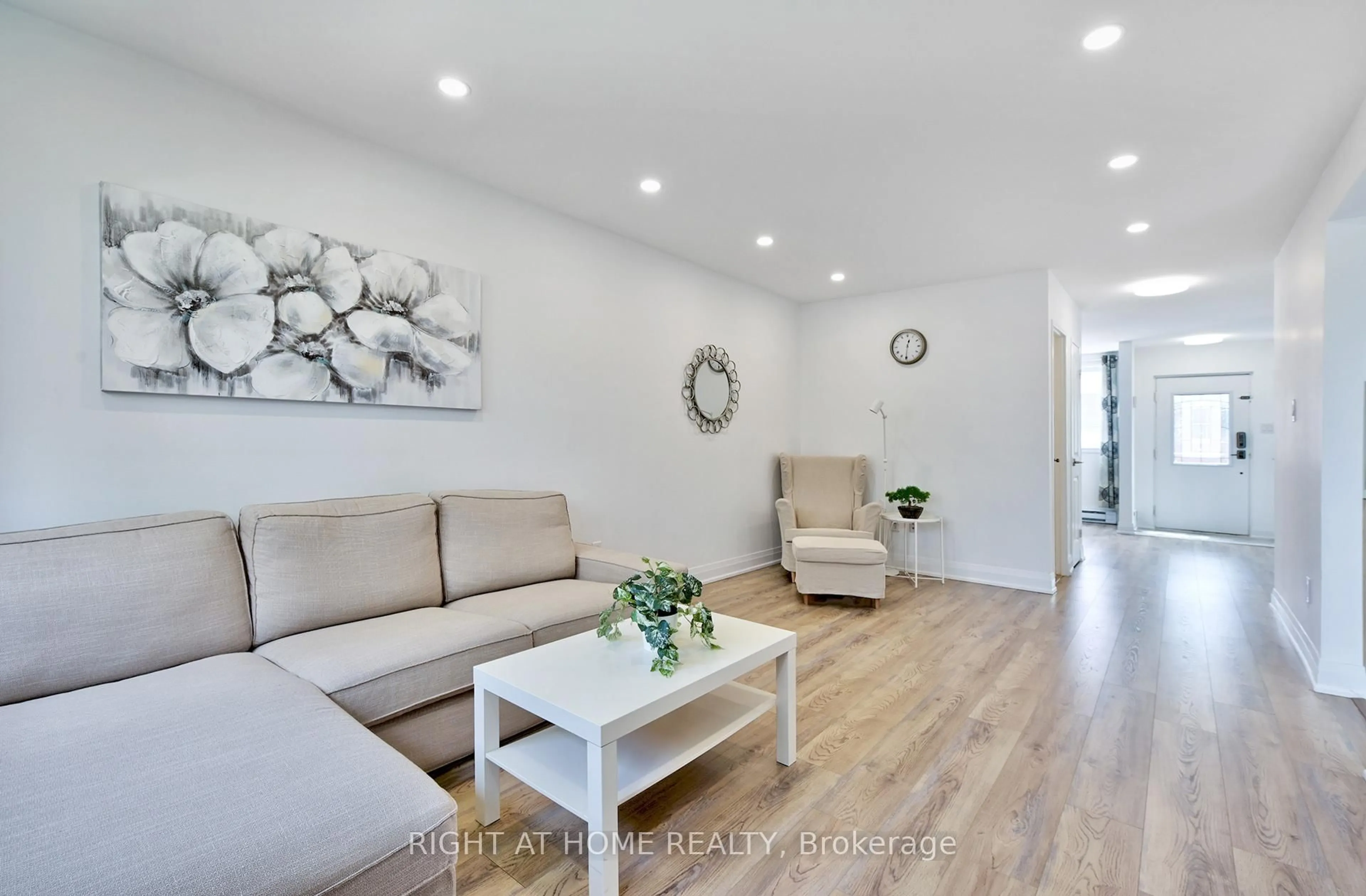 Living room with furniture, wood/laminate floor for 2170 Bromsgrove Rd #197, Mississauga Ontario L5J 4J2