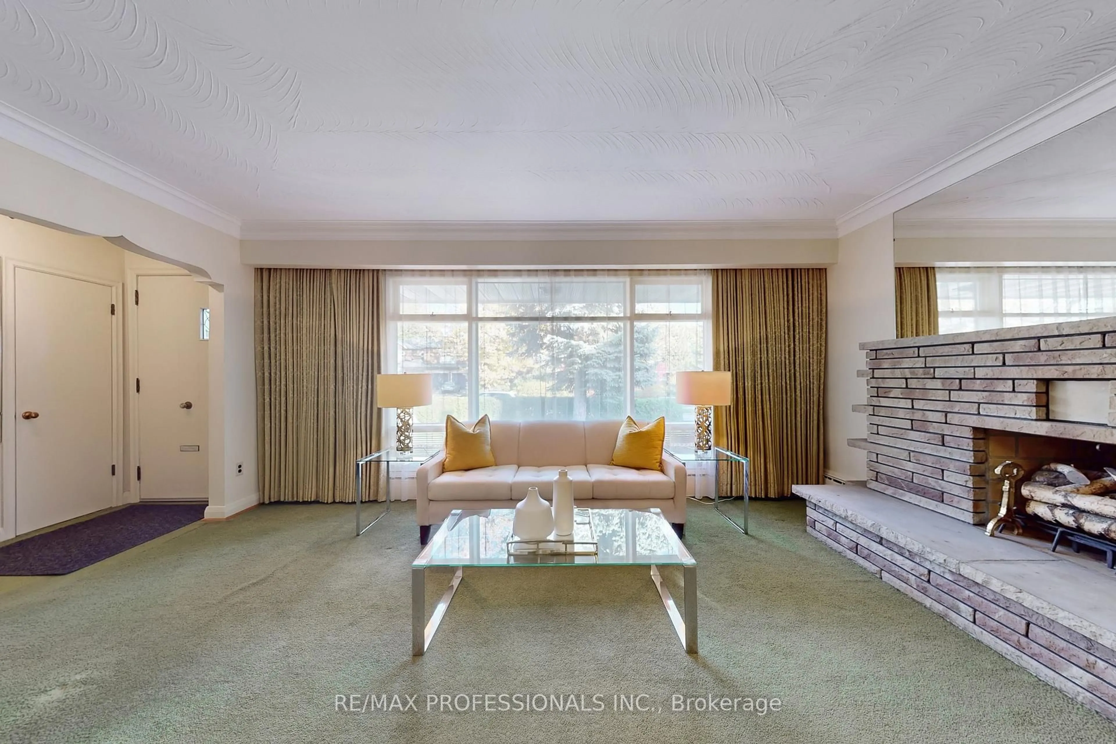 Living room with furniture, carpet floor for 110 Shaver Ave, Toronto Ontario M9B 4N8