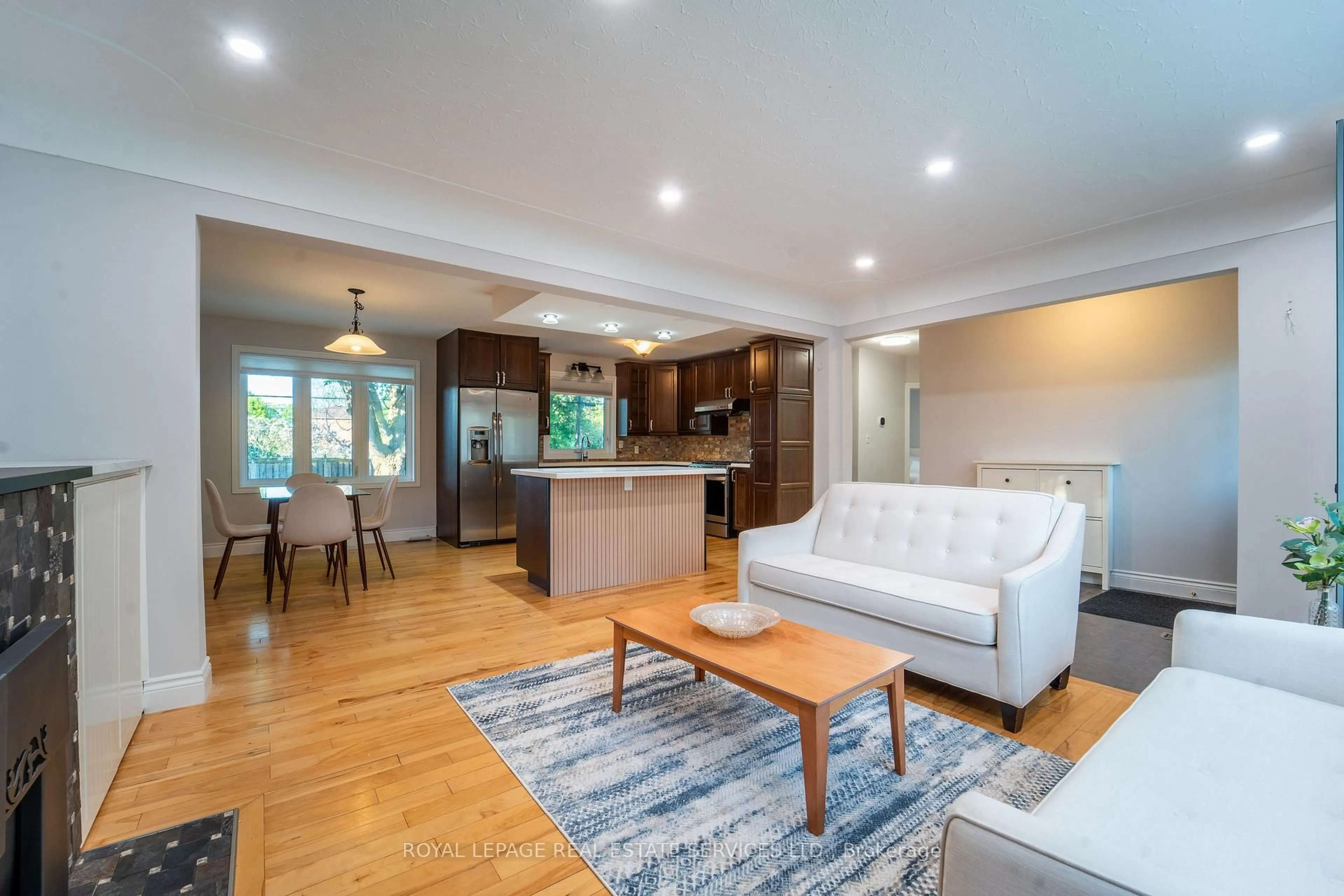 Living room with furniture, wood/laminate floor for 1071 Joan Dr, Burlington Ontario L7T 3H3