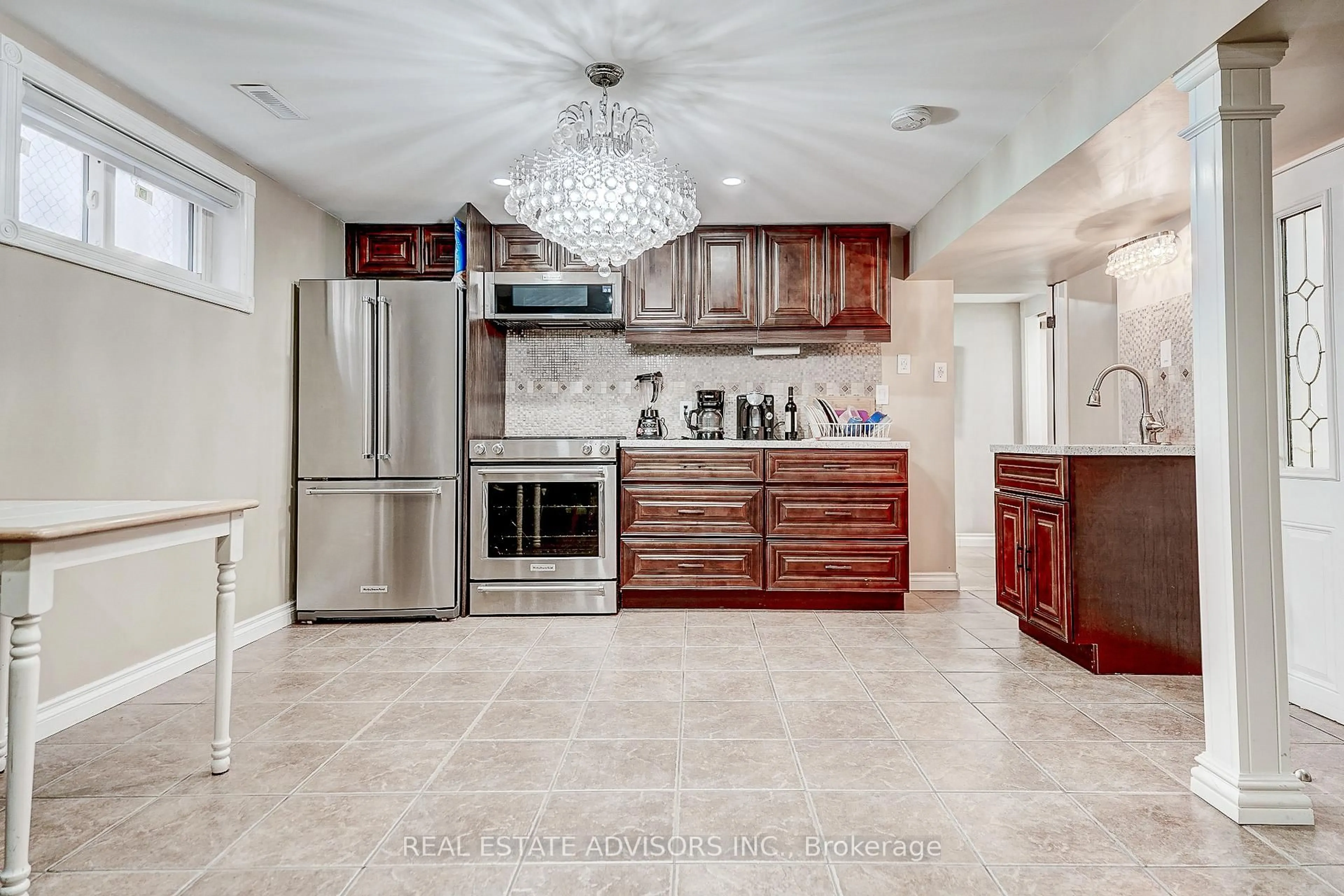 Open concept kitchen, ceramic/tile floor for 1228 Jane St, Toronto Ontario M6M 4X7