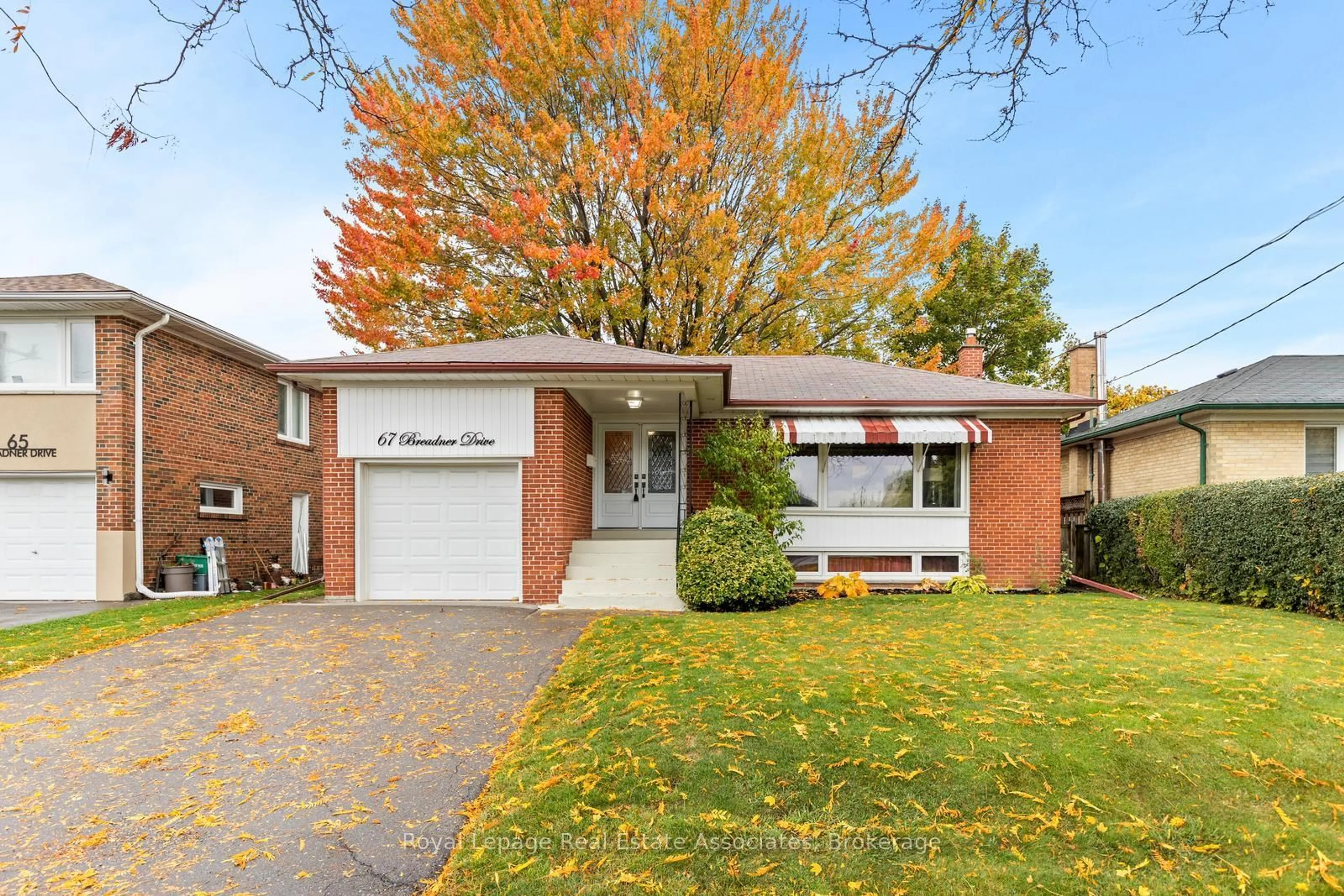 Home with brick exterior material, street for 67 Breadner Dr, Toronto Ontario M9R 3M5