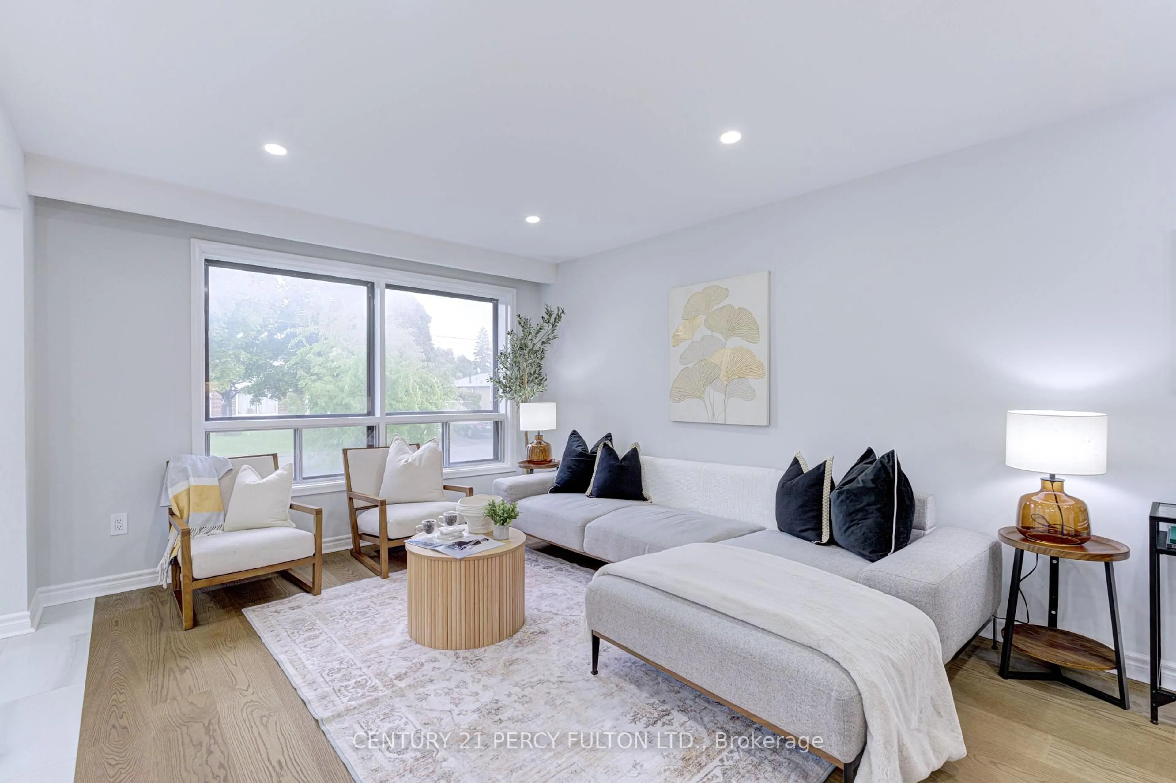 Living room with furniture, wood/laminate floor for 7146 Harwick Dr, Mississauga Ontario L4T 3A4