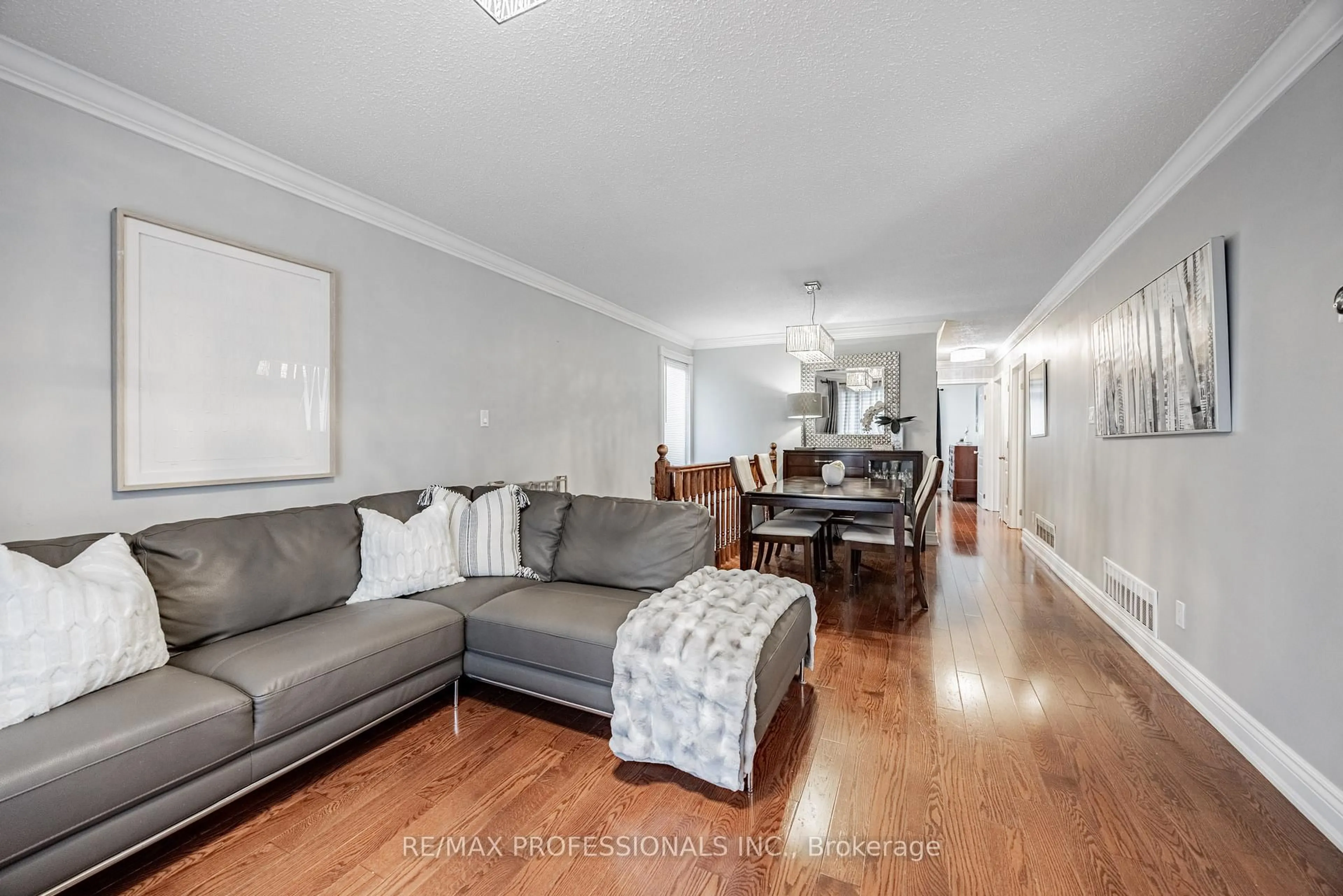 Living room with furniture, wood/laminate floor for 108 Avening Dr, Toronto Ontario M9V 4E6