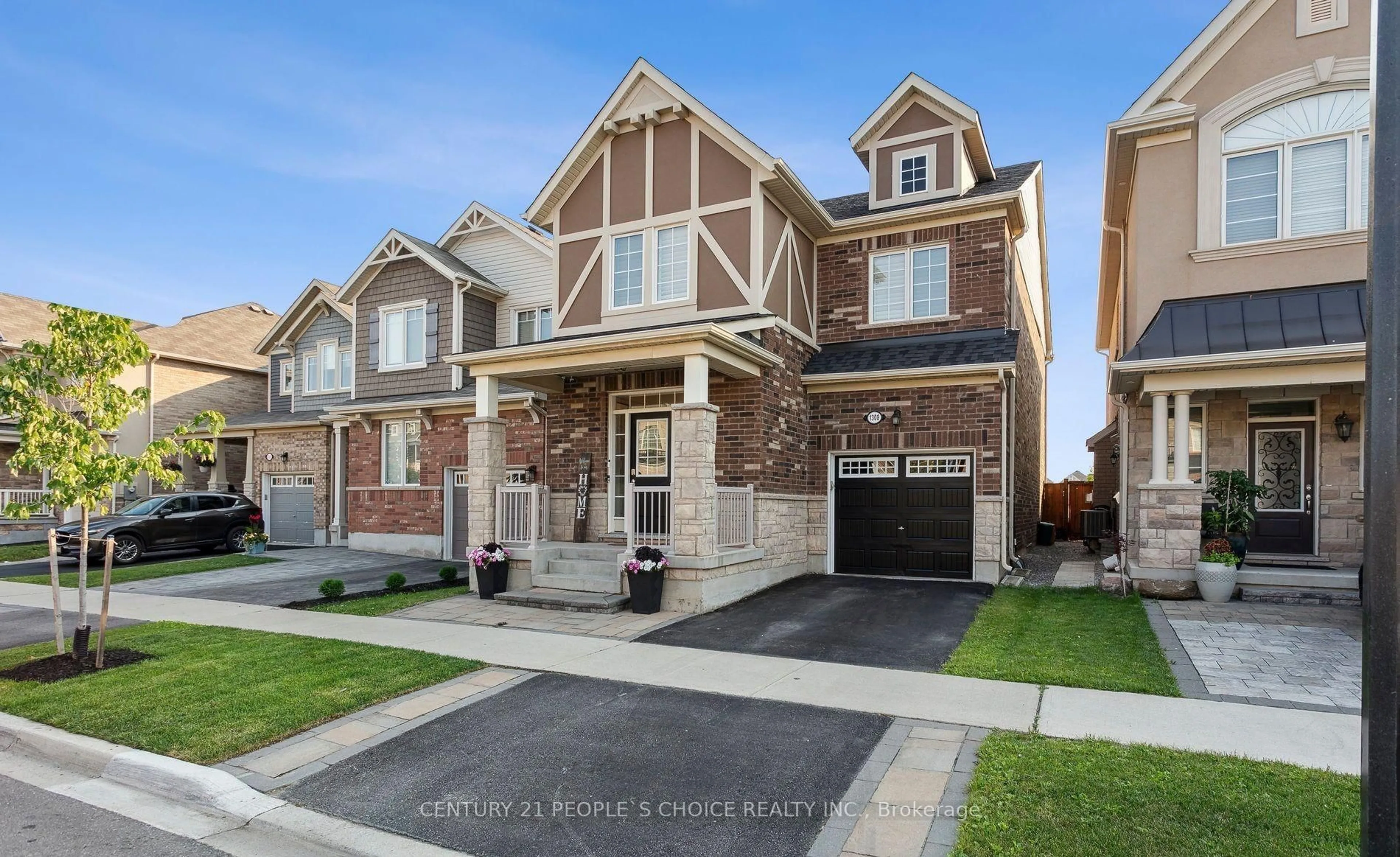 Home with brick exterior material, street for 1308 Leger Way, Milton Ontario L9E 1C9