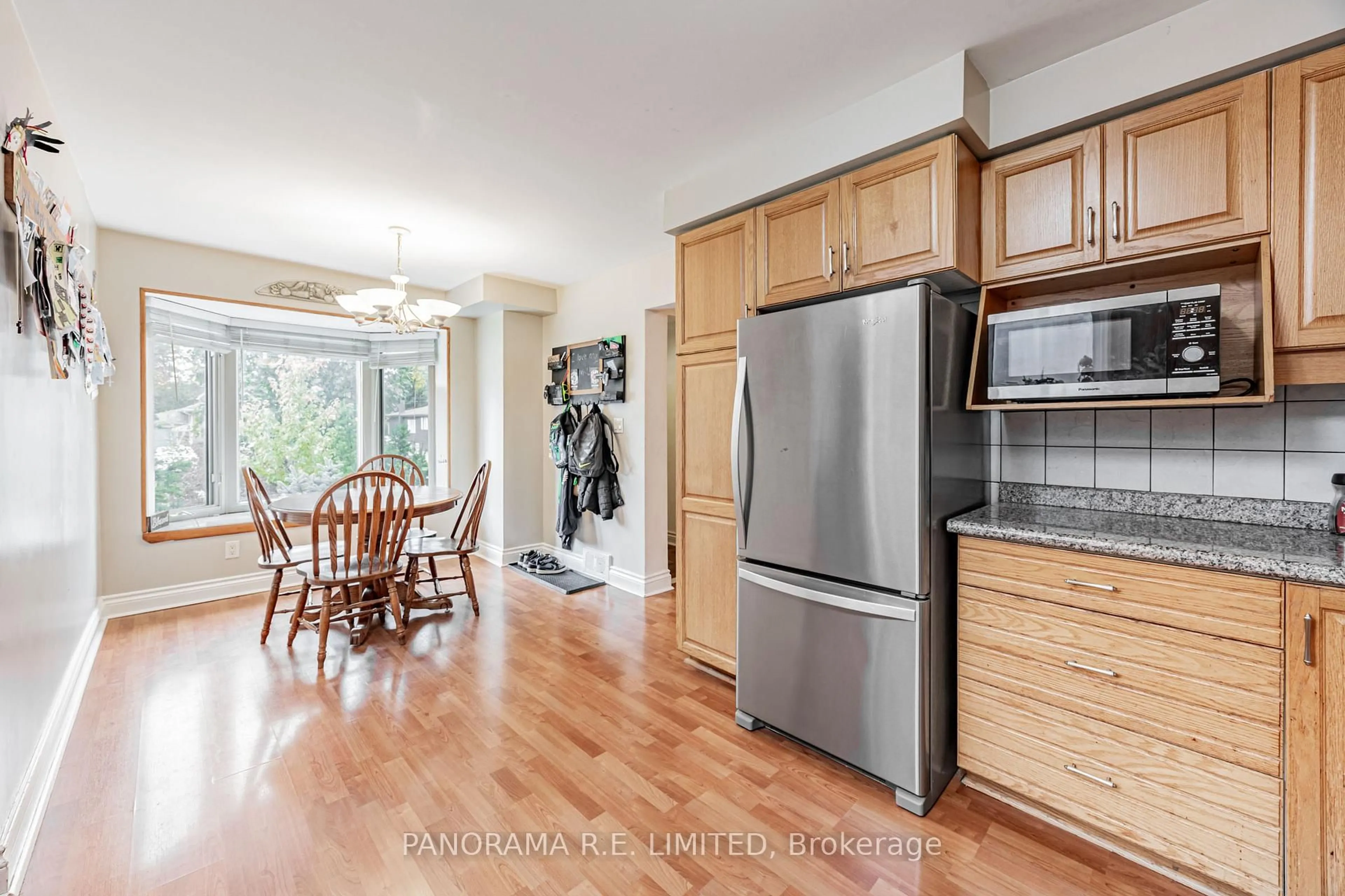 Open concept kitchen, wood/laminate floor for 30 Cowley Ave, Toronto Ontario M9B 2E3