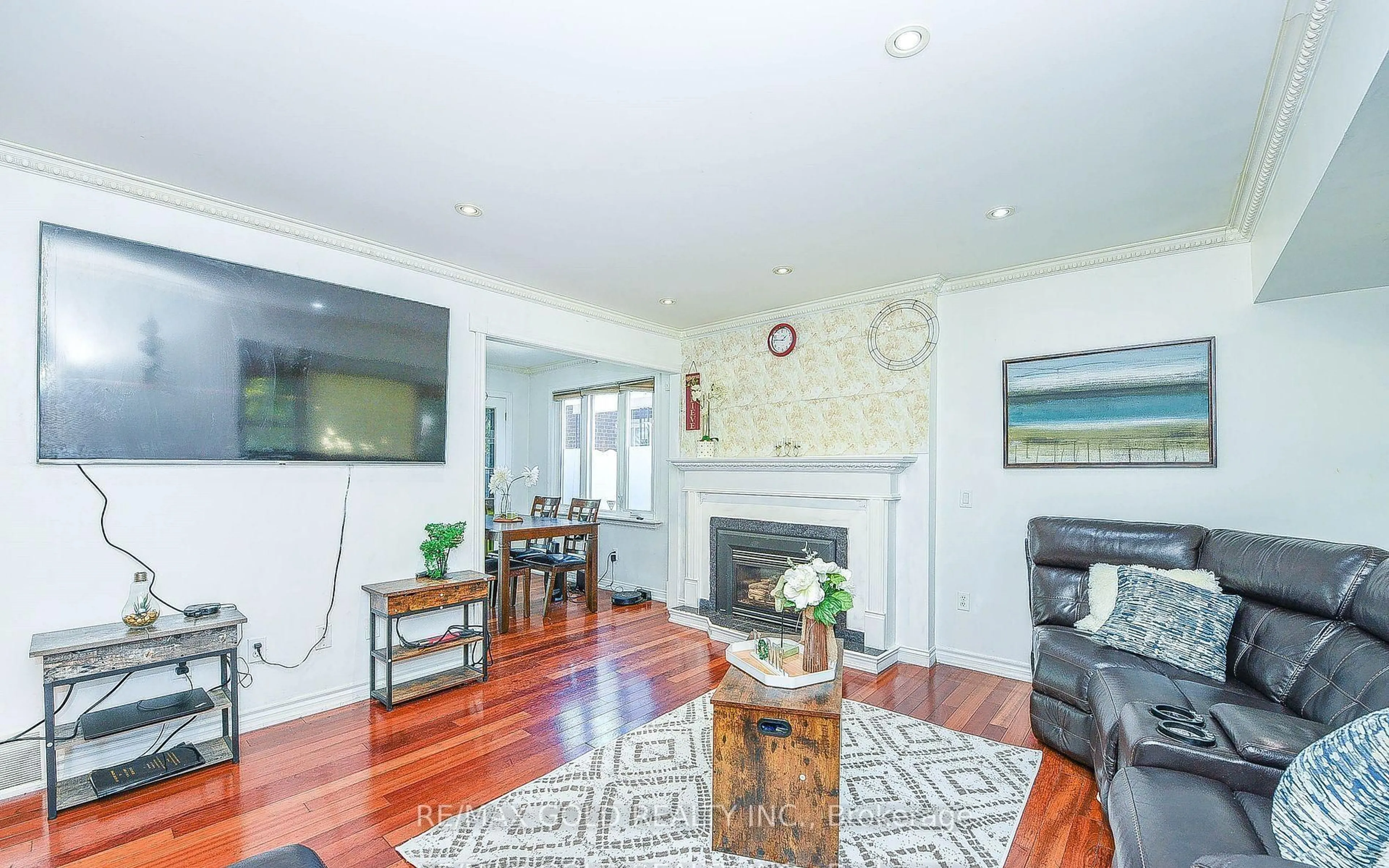 Living room with furniture, wood/laminate floor for 13 Foster Rd, Mississauga Ontario L4T 1C3