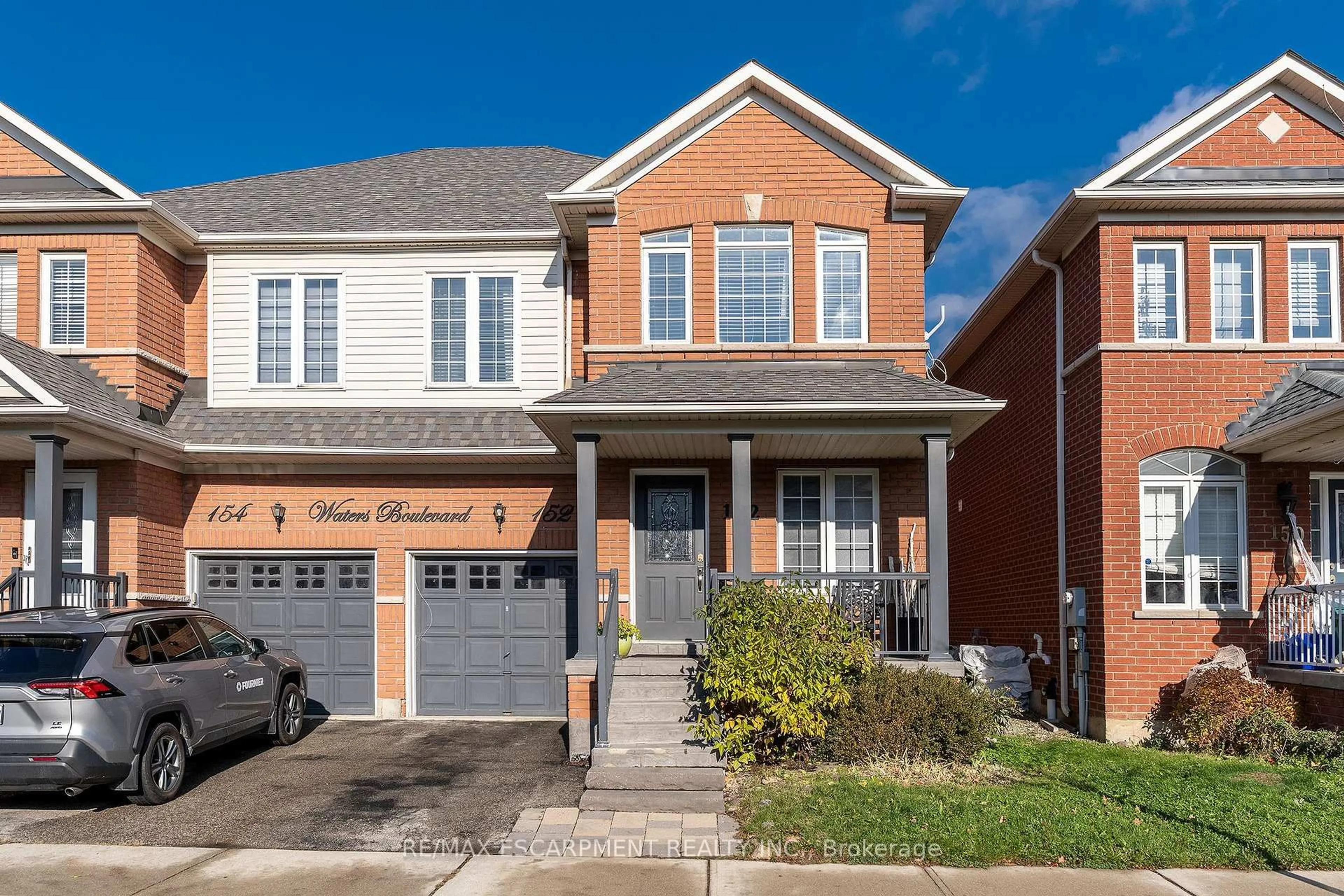 Home with brick exterior material, street for 152 Waters Blvd, Milton Ontario L9T 6K5
