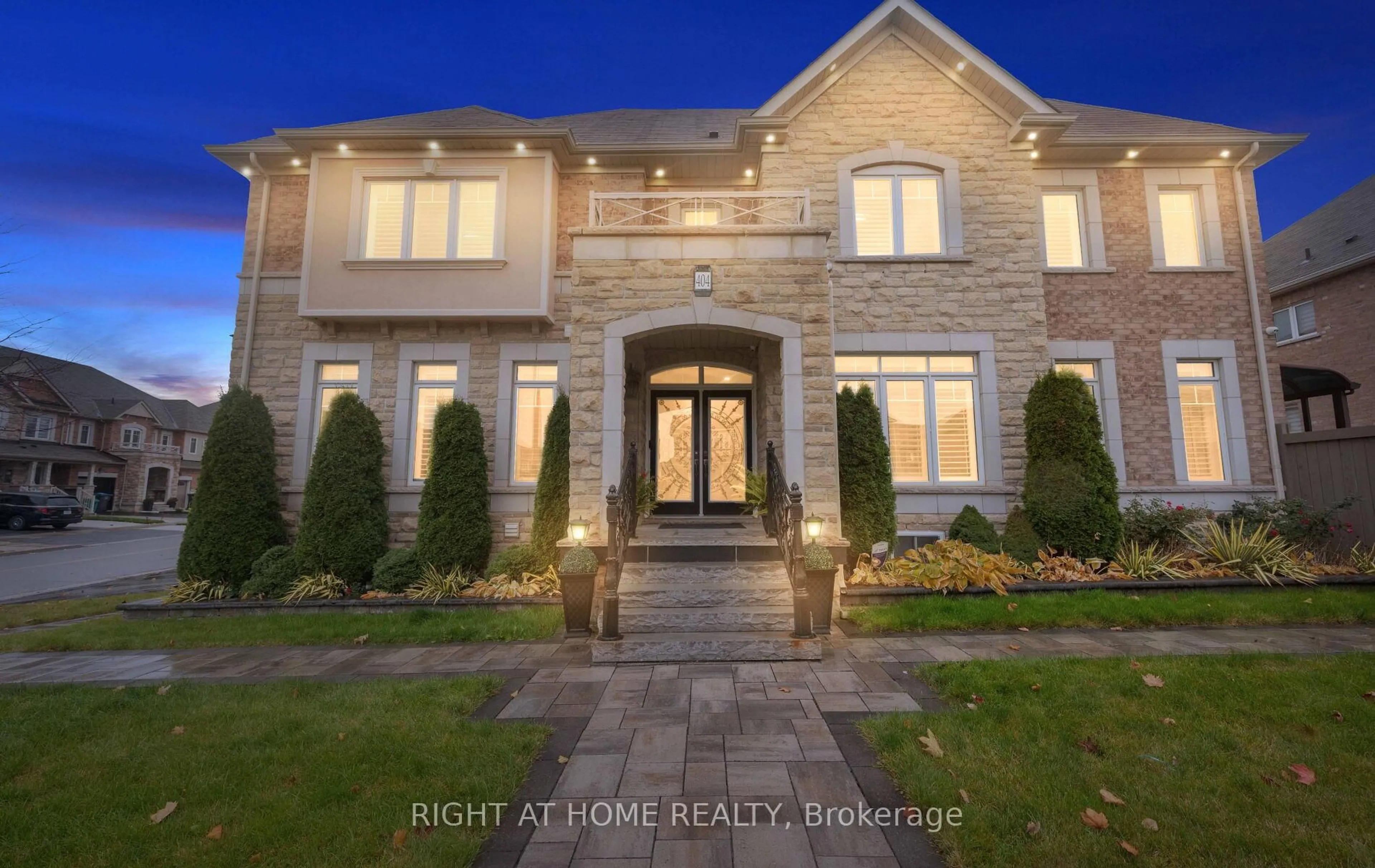 Home with brick exterior material, street for 404 Queen Mary Dr, Brampton Ontario L7A 4K4