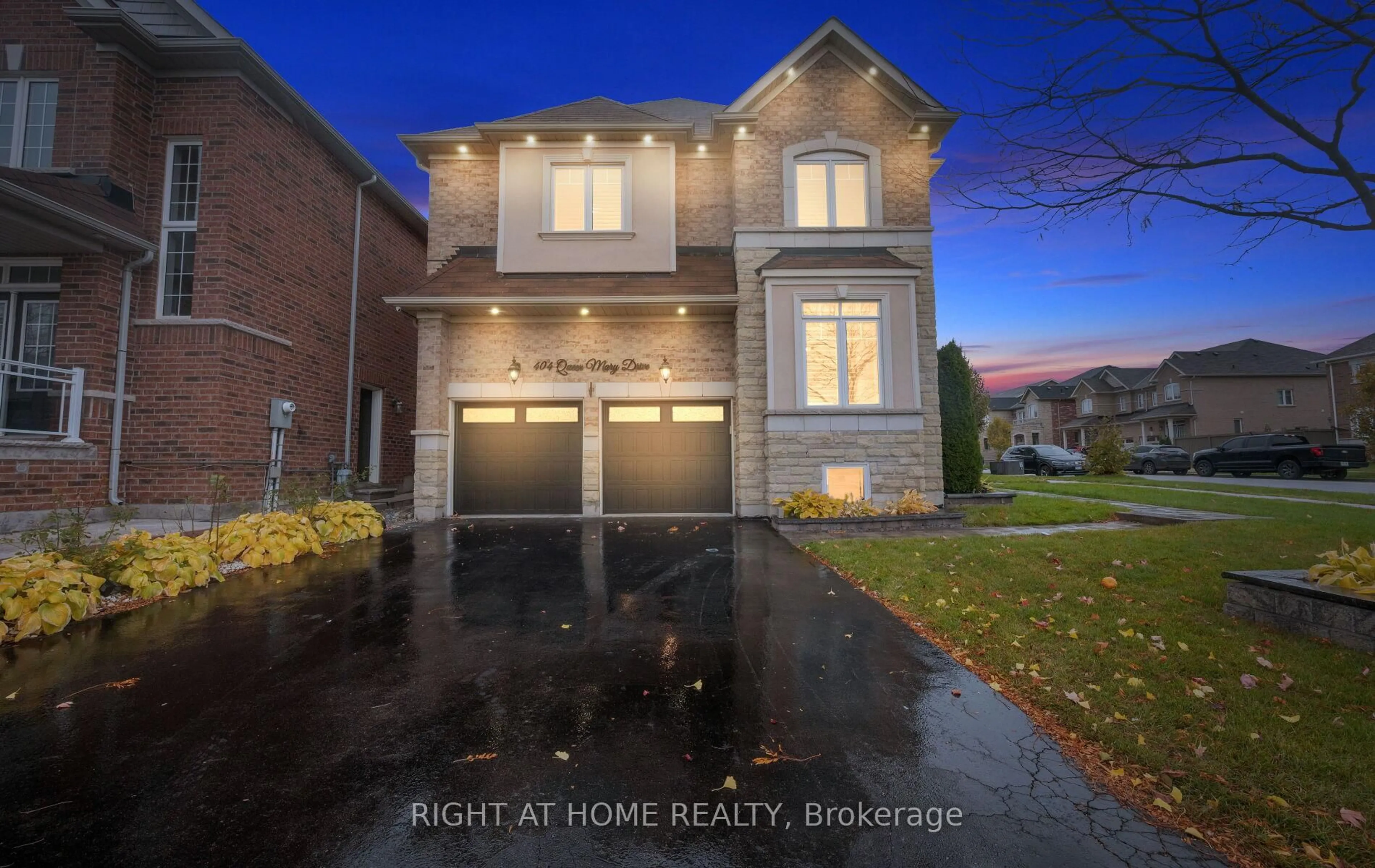 Home with brick exterior material, street for 404 Queen Mary Dr, Brampton Ontario L7A 4K4