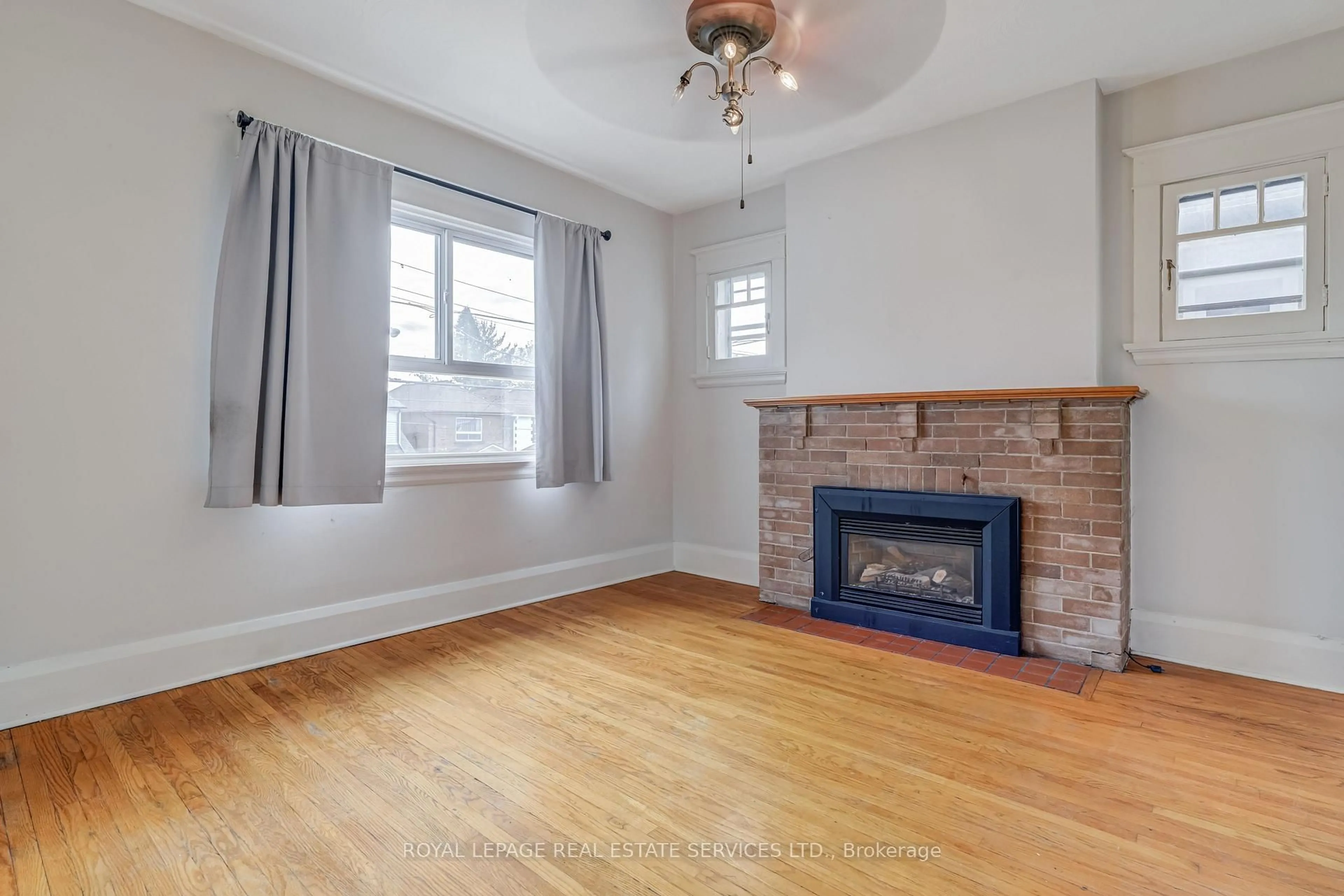 Living room with furniture, wood/laminate floor for 492 Jane St, Toronto Ontario M6S 4A2