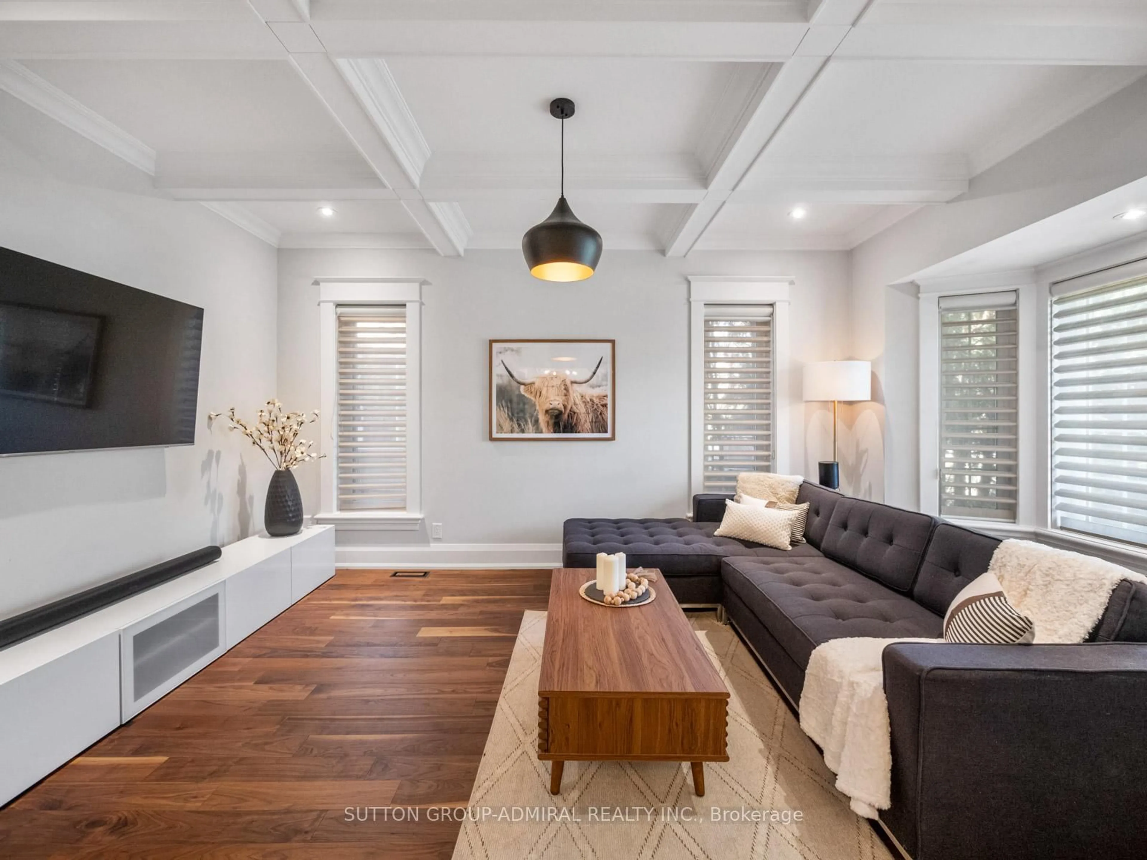 Living room with furniture, wood/laminate floor for 26 Puckeridge Cres, Toronto Ontario M9B 3A2