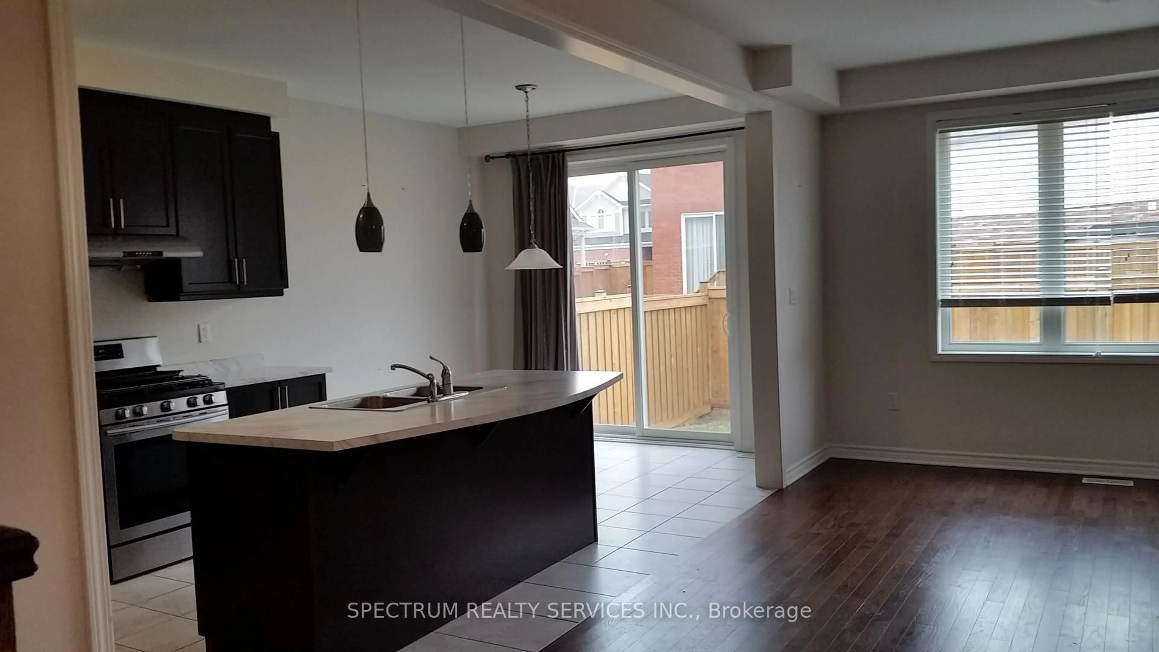 Open concept kitchen, wood/laminate floor for 669 Gibson Cres, Milton Ontario L9T 8Z6