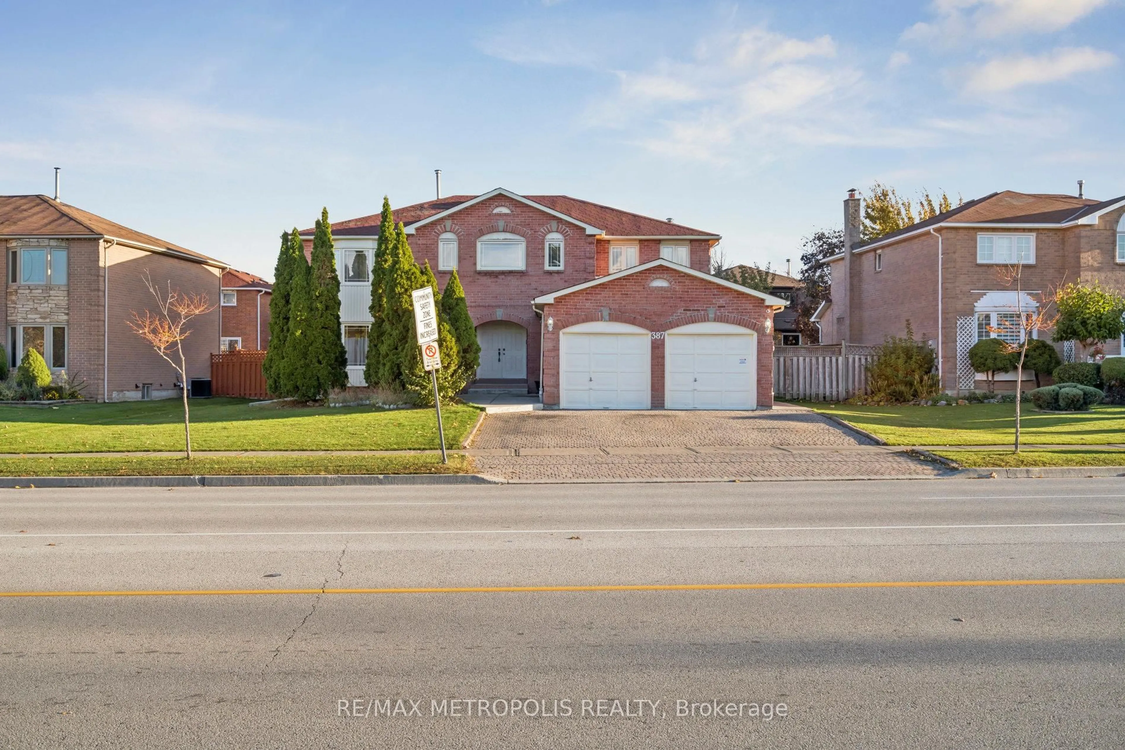 Home with brick exterior material, street for 387 Ray Lawson Blvd, Brampton Ontario L6Y 3X7