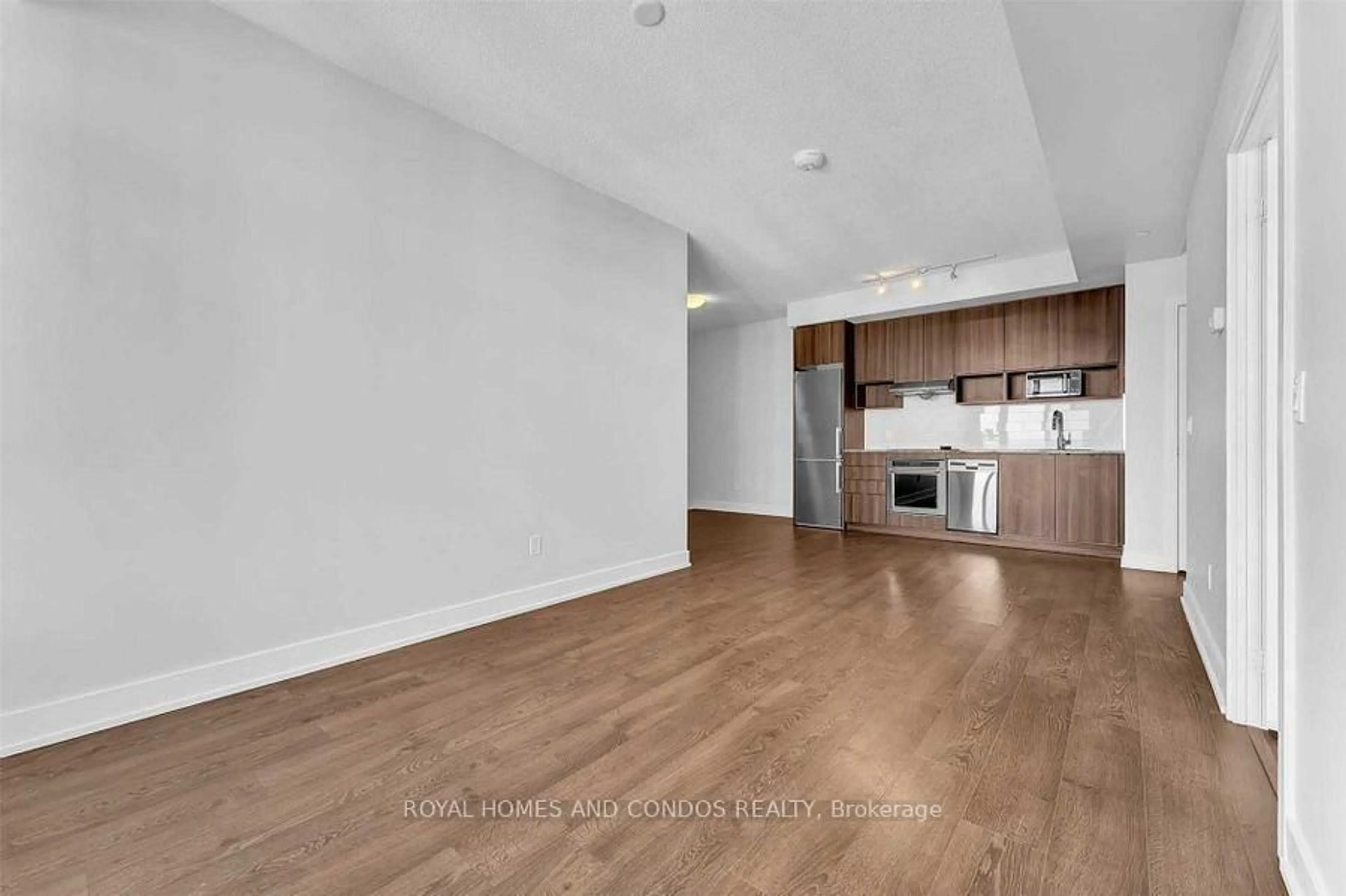 Open concept kitchen, wood/laminate floor for 7 Mabelle Ave #706, Toronto Ontario M9A 4X7