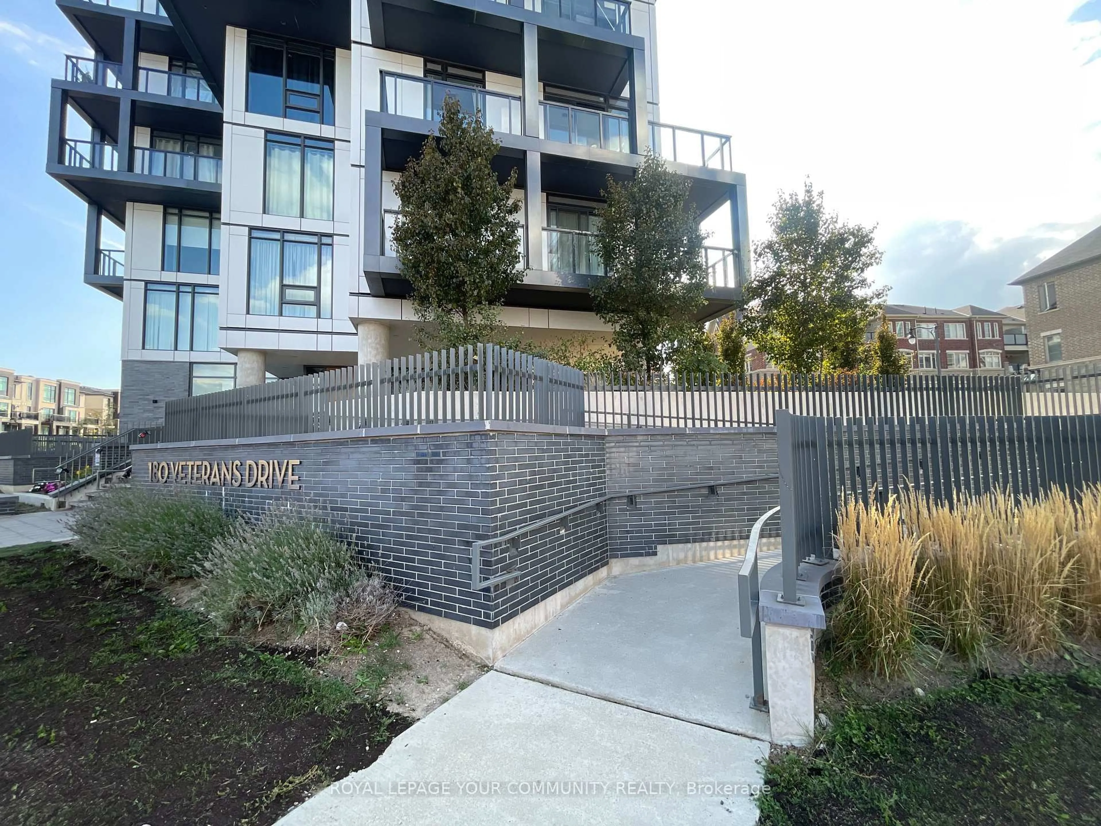 A pic from outside/outdoor area/front of a property/back of a property/a pic from drone, street for 180 Veterans Dr #203, Brampton Ontario L7A 5G7