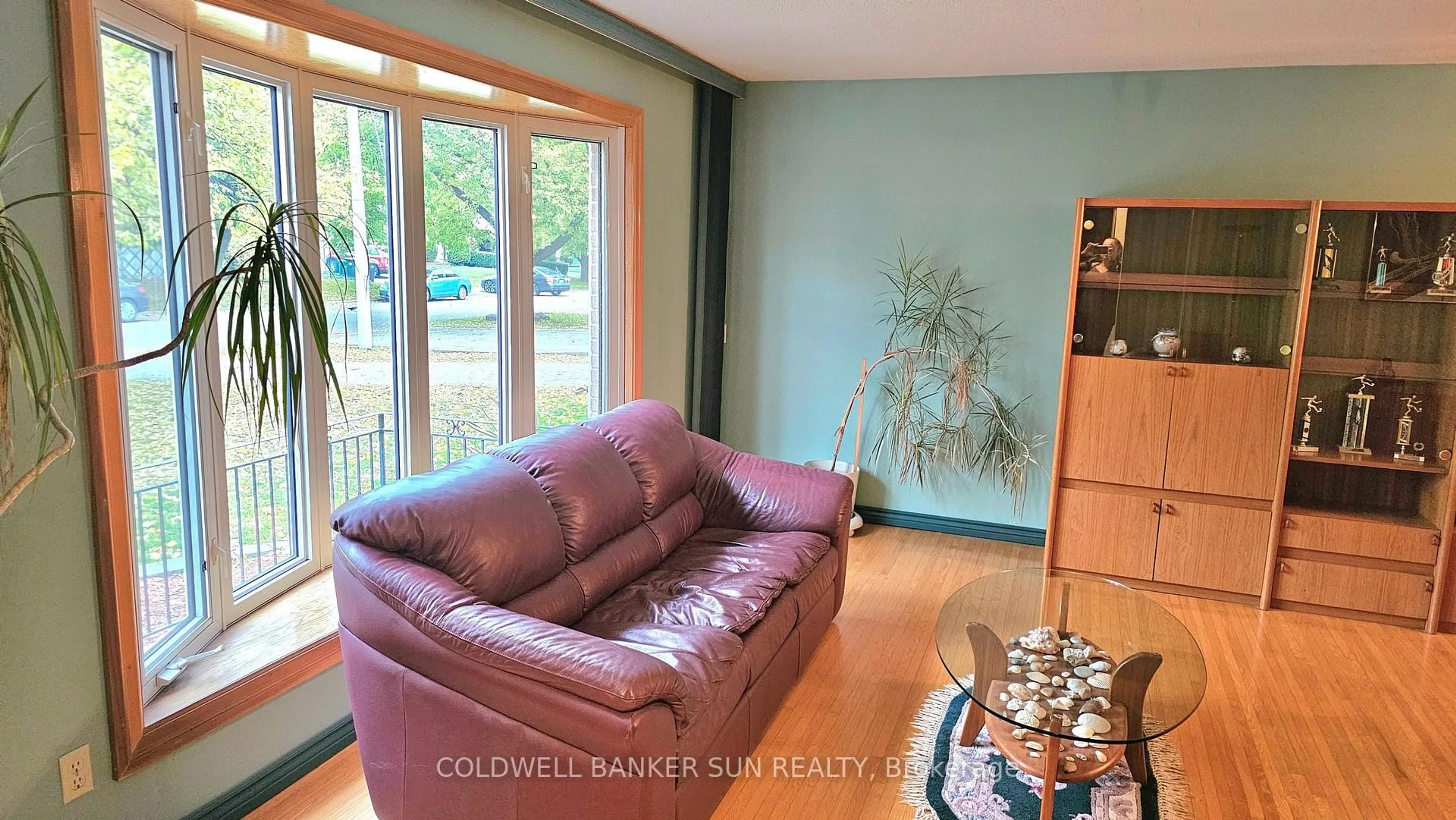 Living room with furniture, wood/laminate floor for 23 Brookdale Cres, Brampton Ontario L6T 1M8