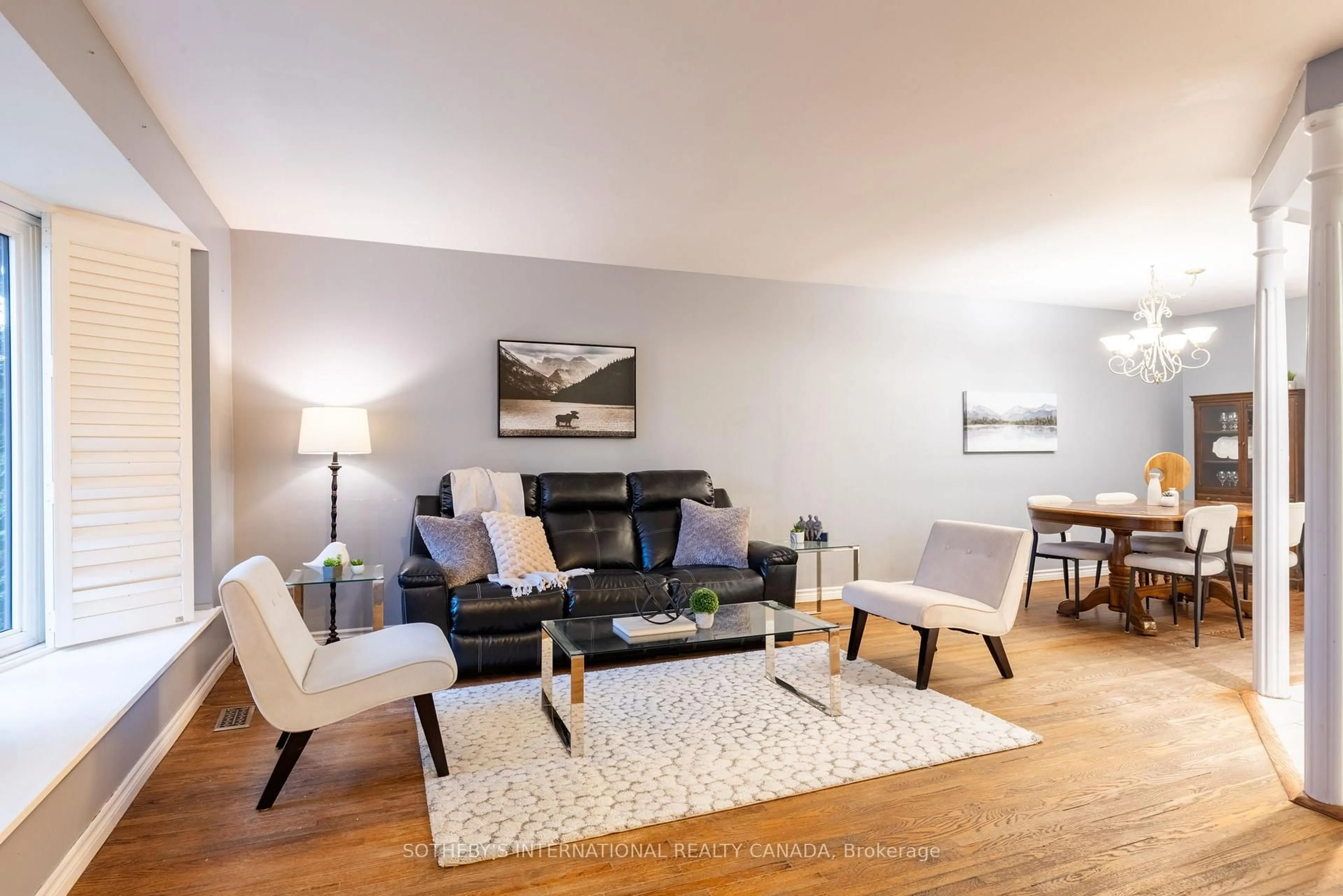 Living room with furniture, wood/laminate floor for 14 Beckenham Crt, Toronto Ontario M9C 3K9