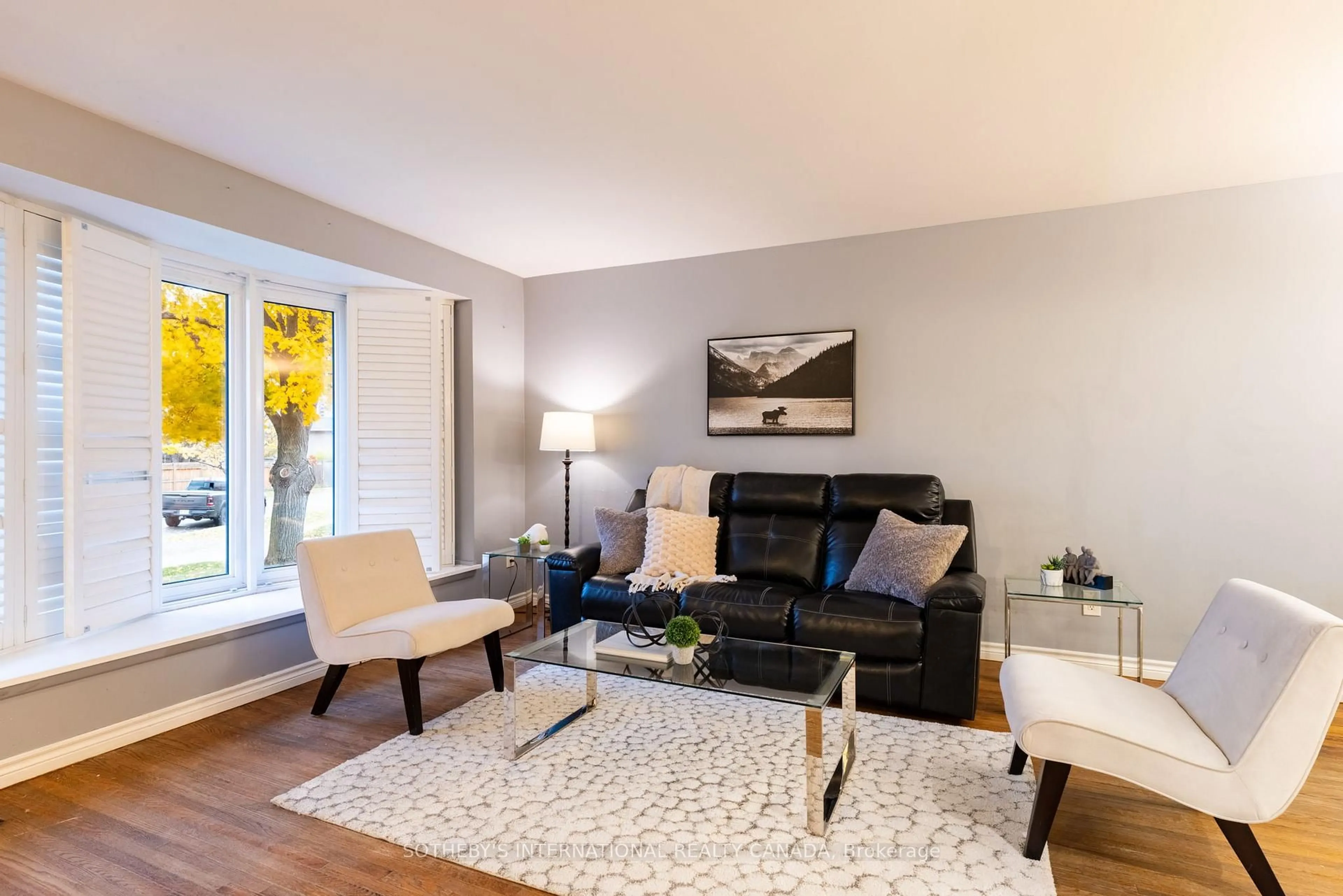 Living room with furniture, wood/laminate floor for 14 Beckenham Crt, Toronto Ontario M9C 3K9