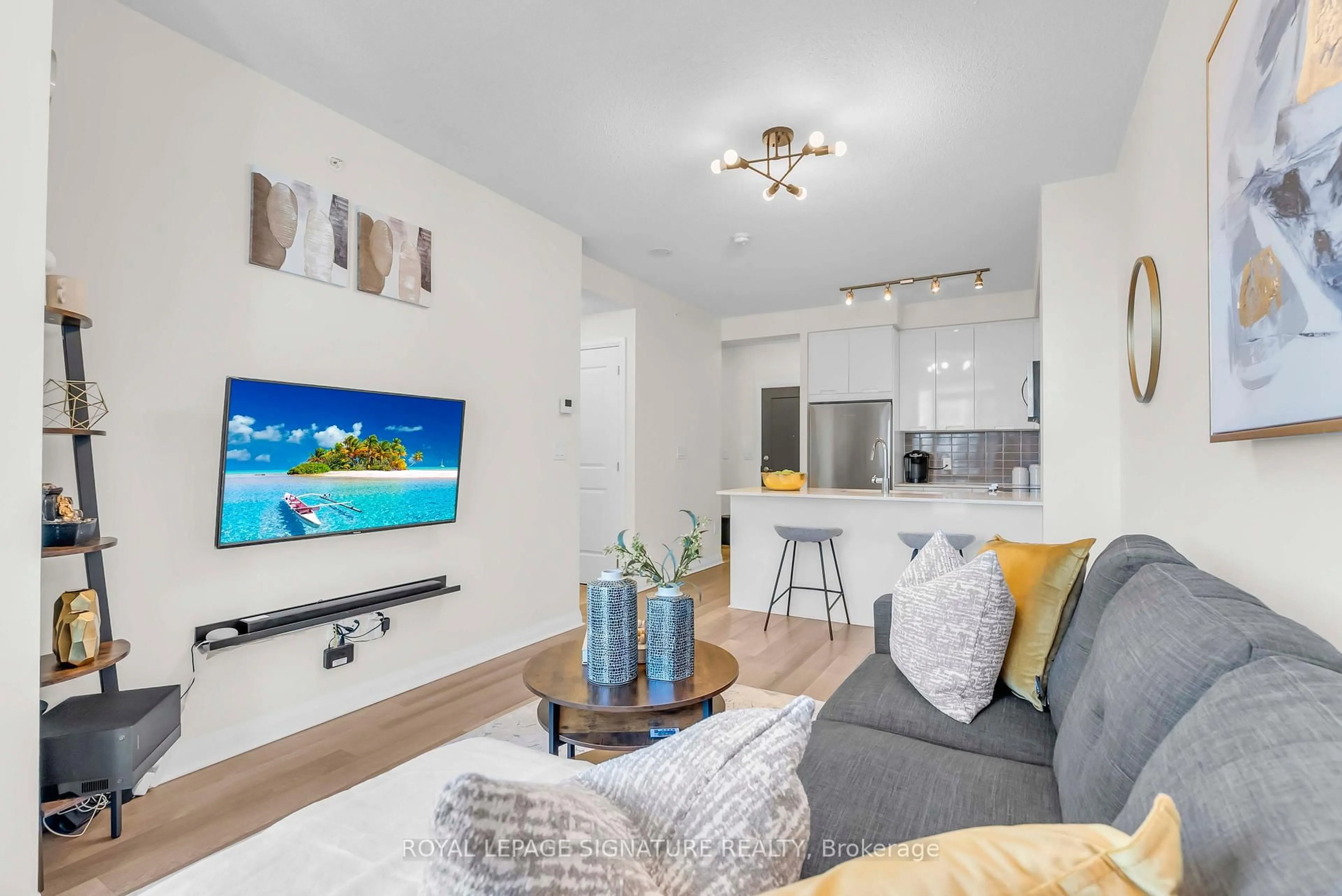 Living room with furniture, wood/laminate floor for 5033 Four Springs Ave #1811, Mississauga Ontario L5R 0G6