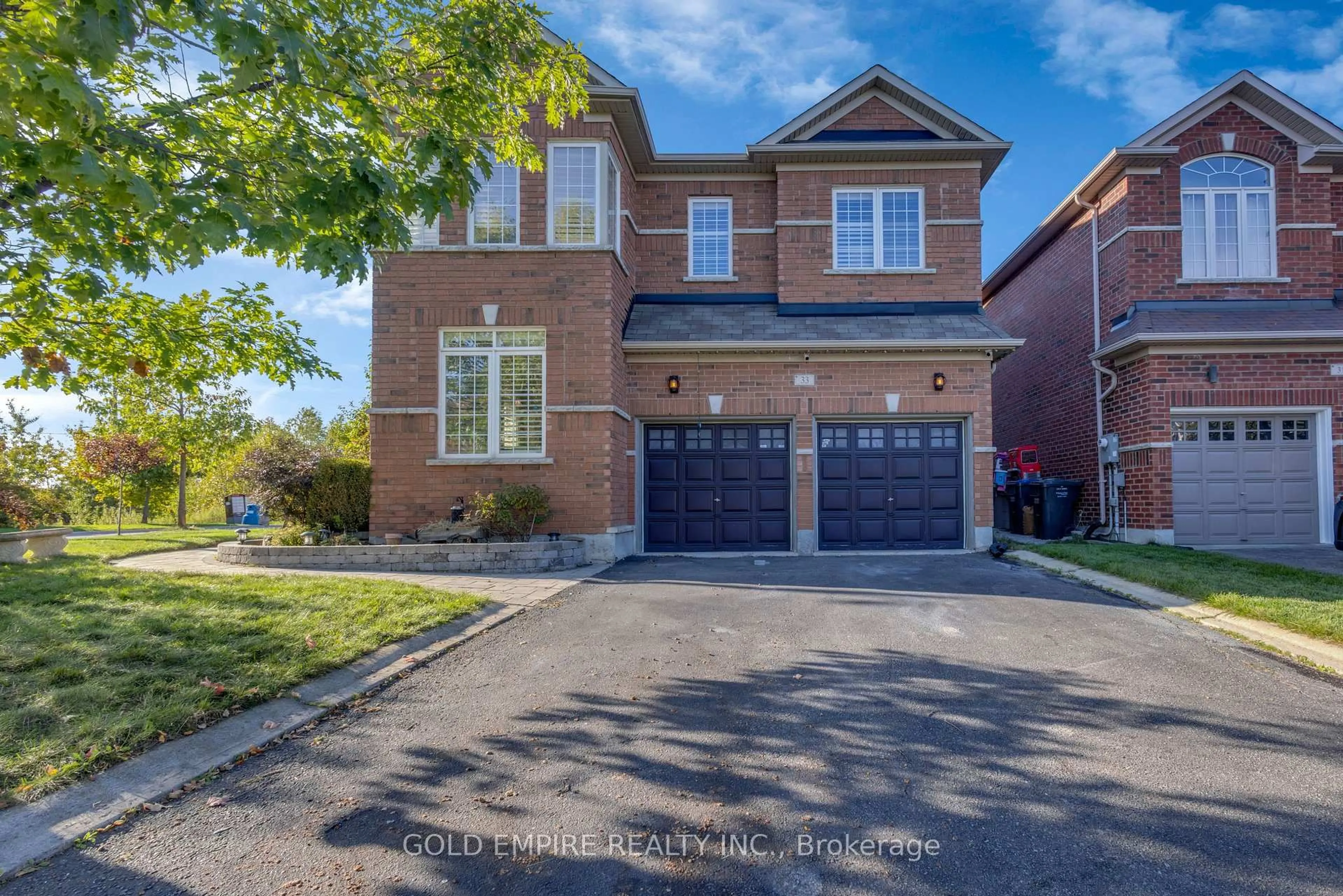 Home with brick exterior material, street for 33 Accent Circ, Brampton Ontario L7A 0L3