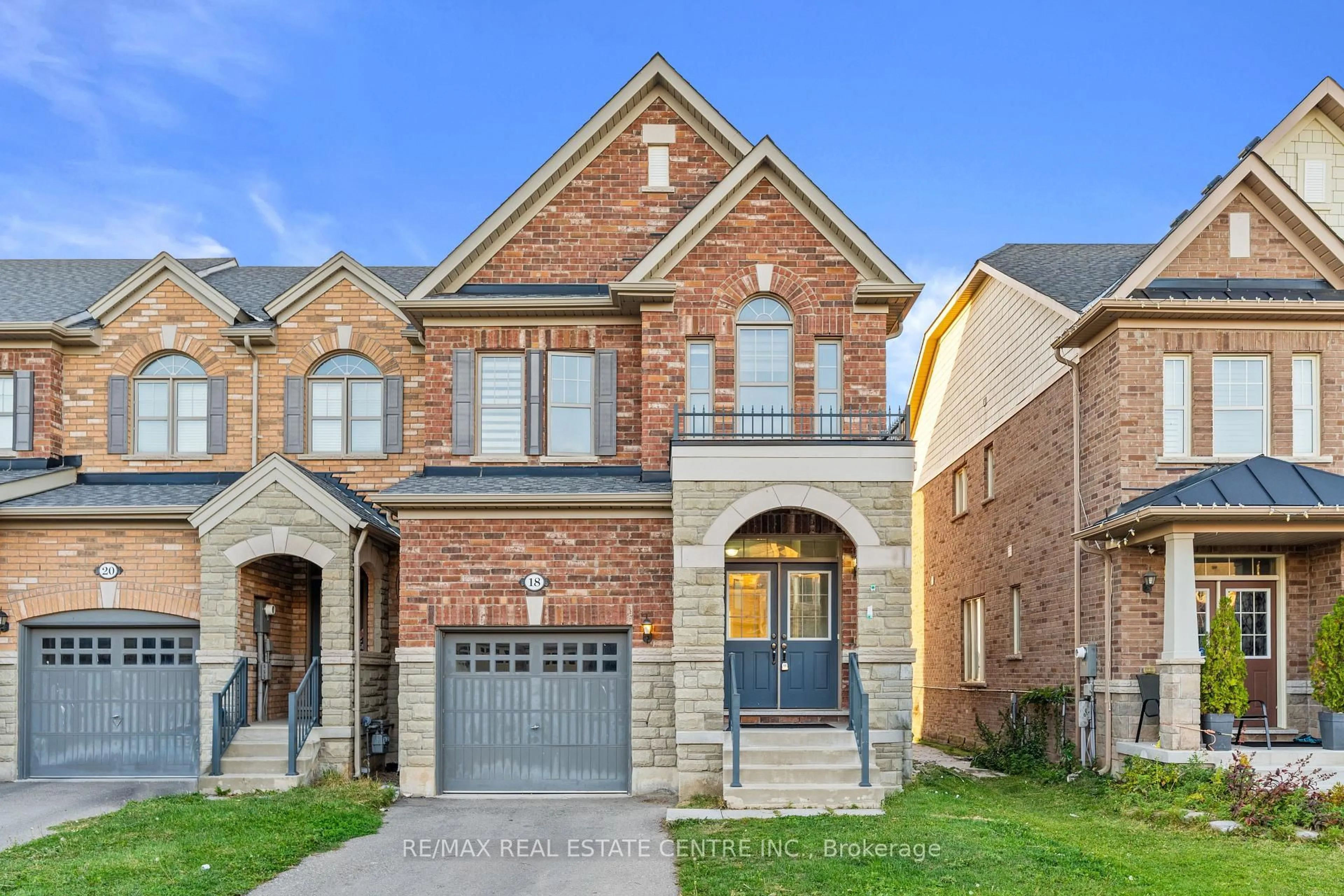 Home with brick exterior material, street for 18 Hogan Manor Dr, Brampton Ontario L7A 4V4