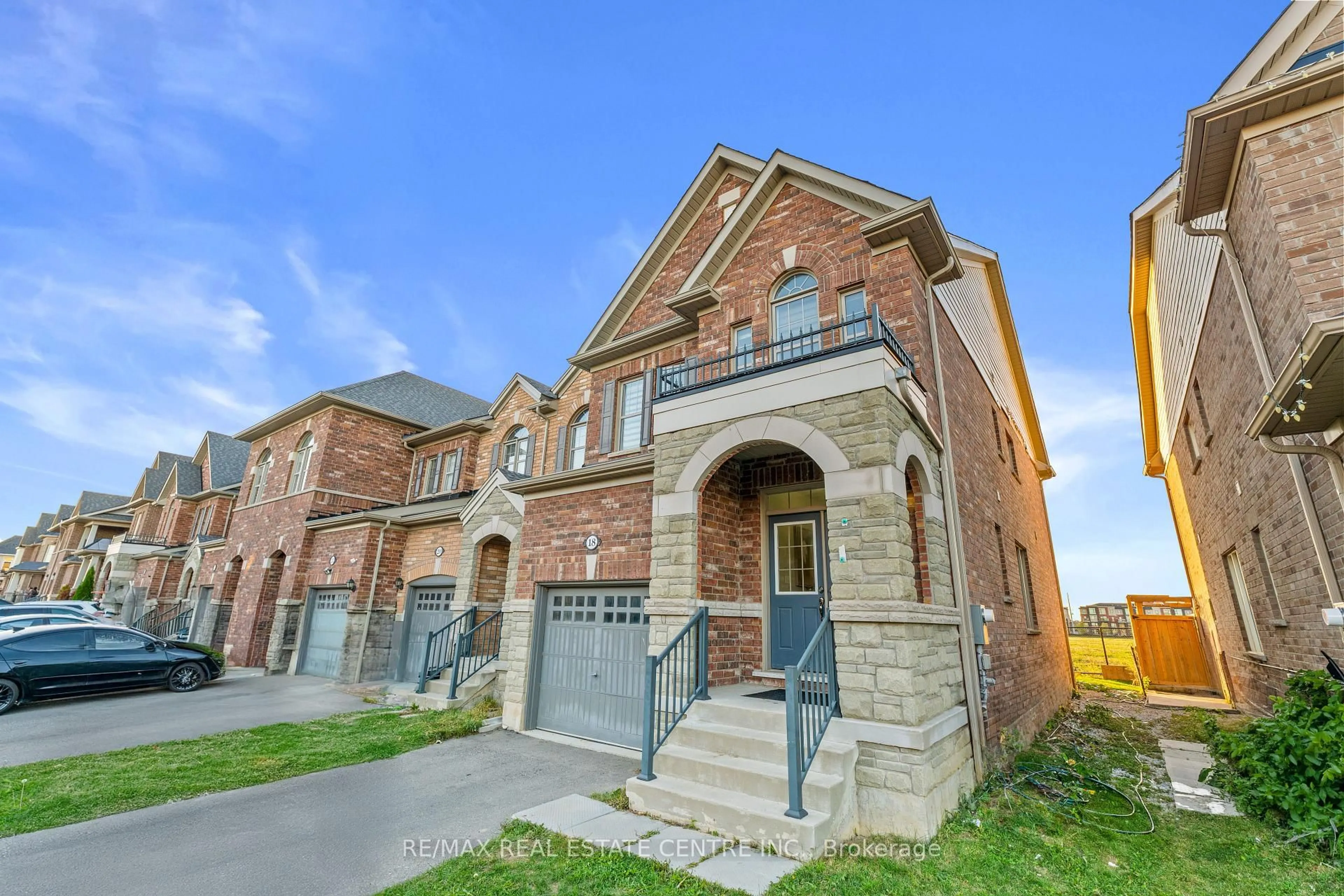 Home with brick exterior material, street for 18 Hogan Manor Dr, Brampton Ontario L7A 4V4