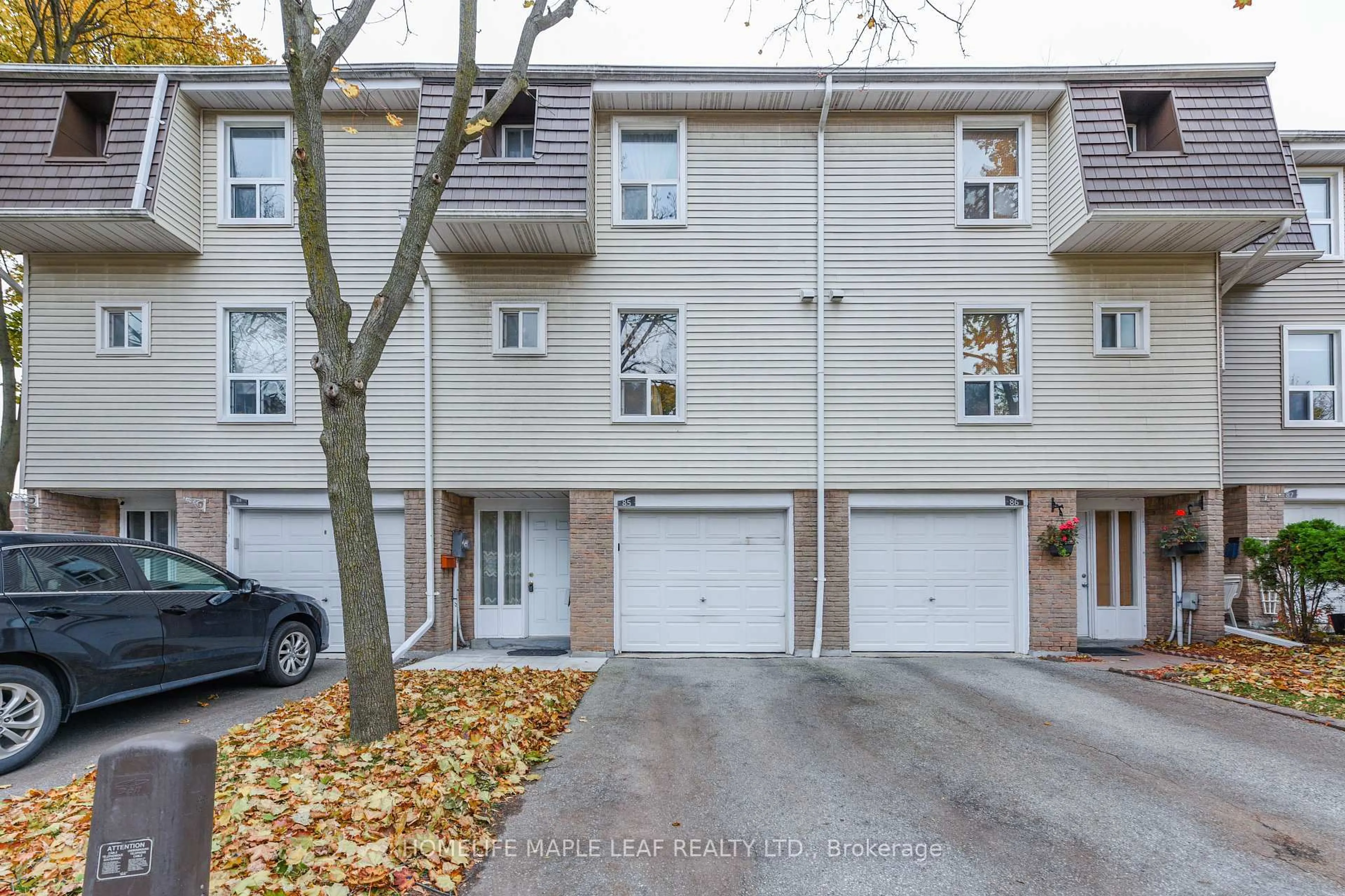 A pic from outside/outdoor area/front of a property/back of a property/a pic from drone, street for 85 Enmount Dr #85, Brampton Ontario L6T 4C9