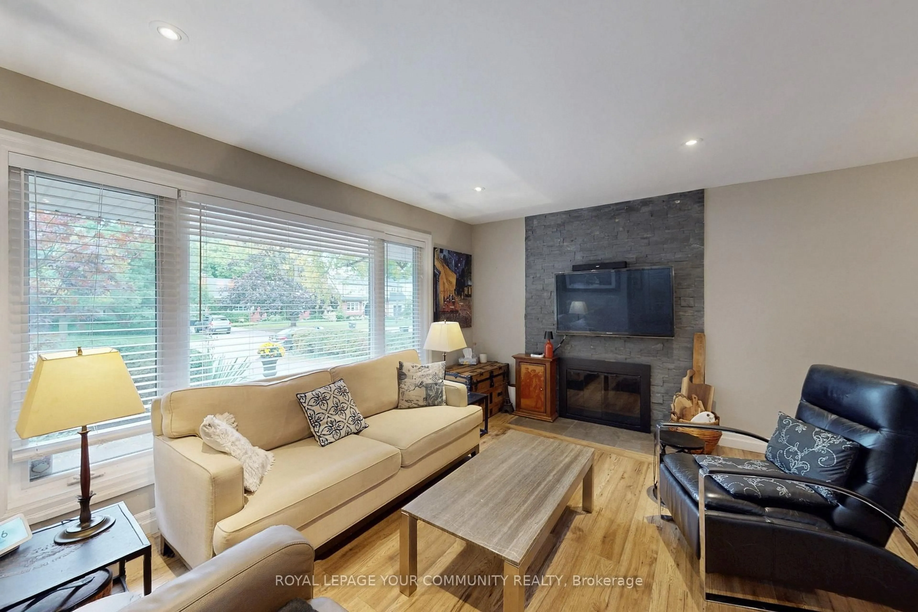Living room with furniture, wood/laminate floor for 2169 Paisley Ave, Burlington Ontario L7R 1W1