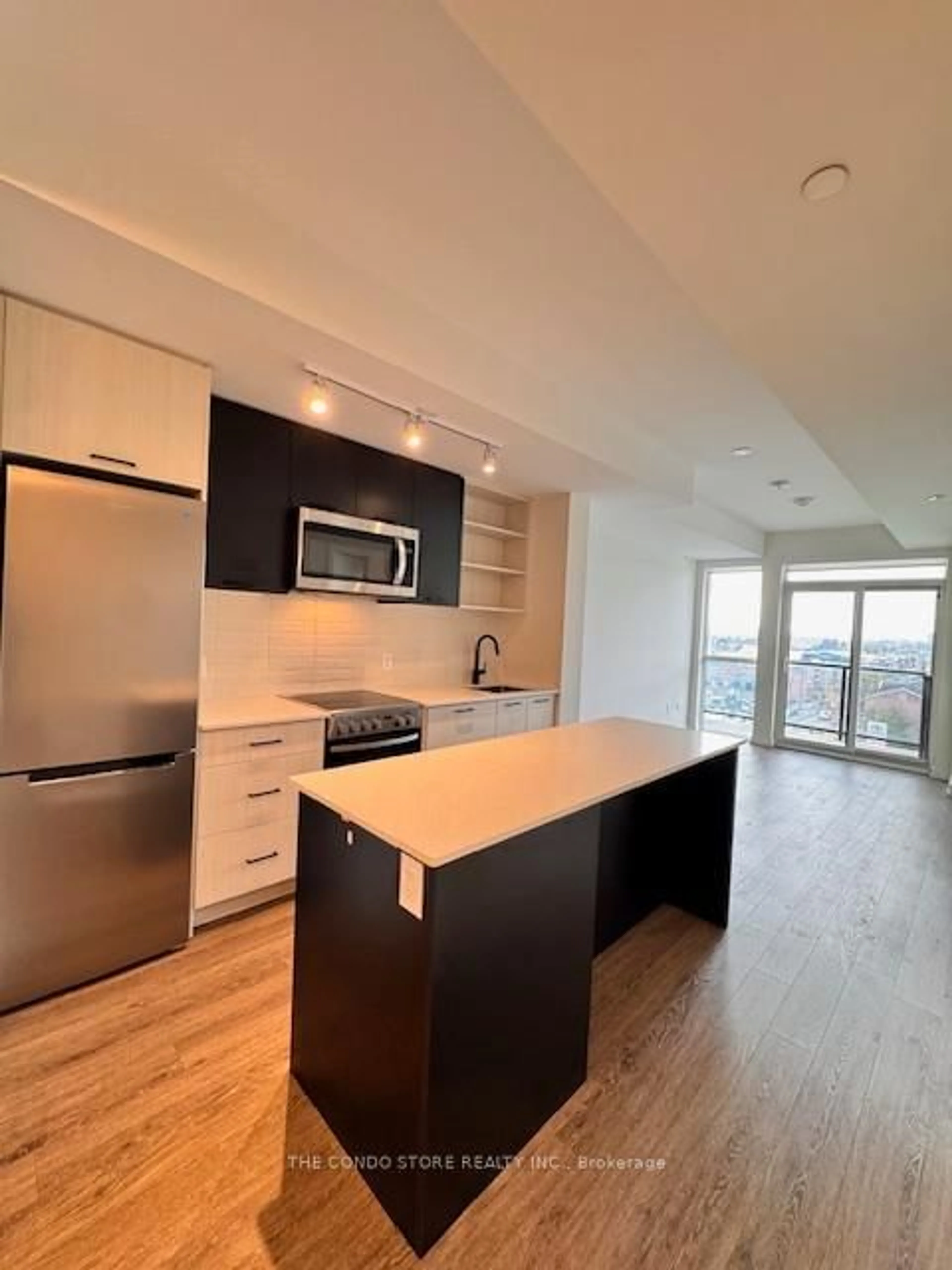 Open concept kitchen, wood/laminate floor for 2300 St. Clair Ave #702, Toronto Ontario M6N 0B3