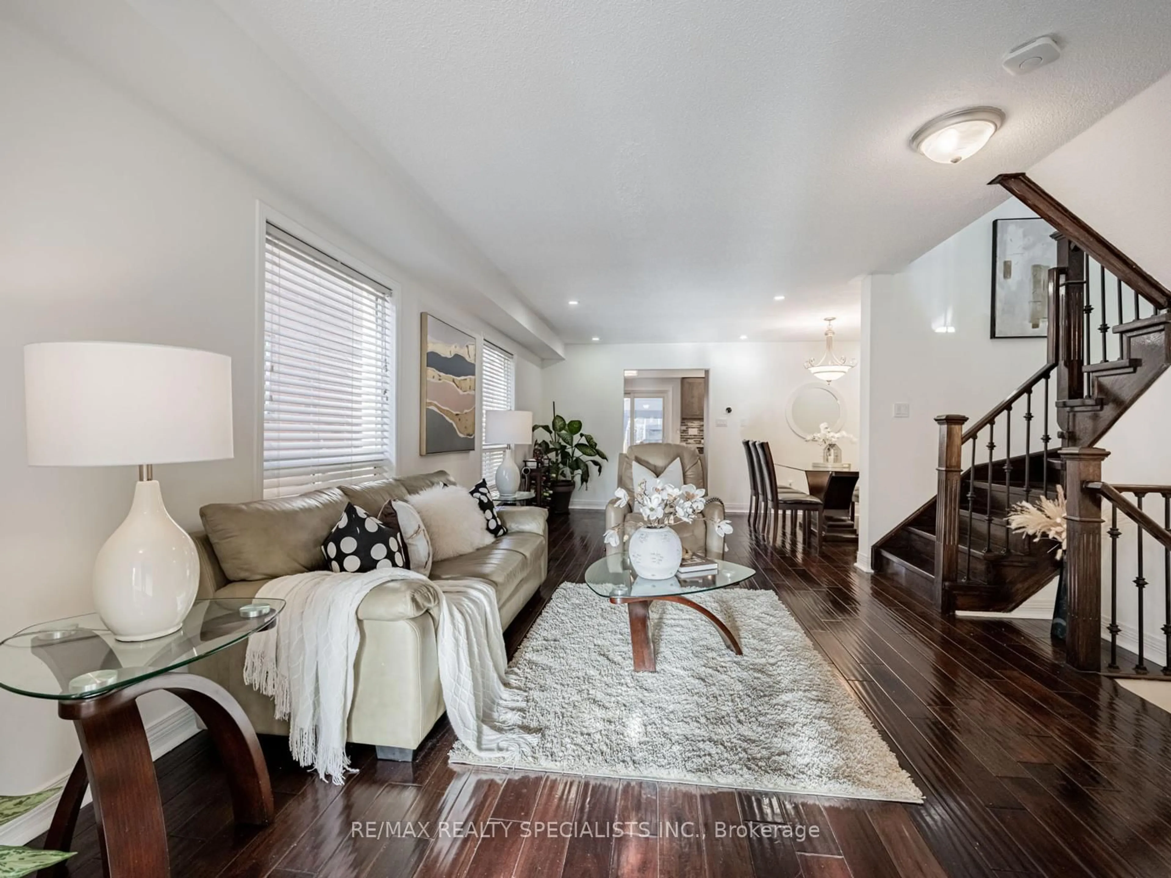 Living room with furniture, wood/laminate floor for 30 Baha Cres, Brampton Ontario L7A 2J3