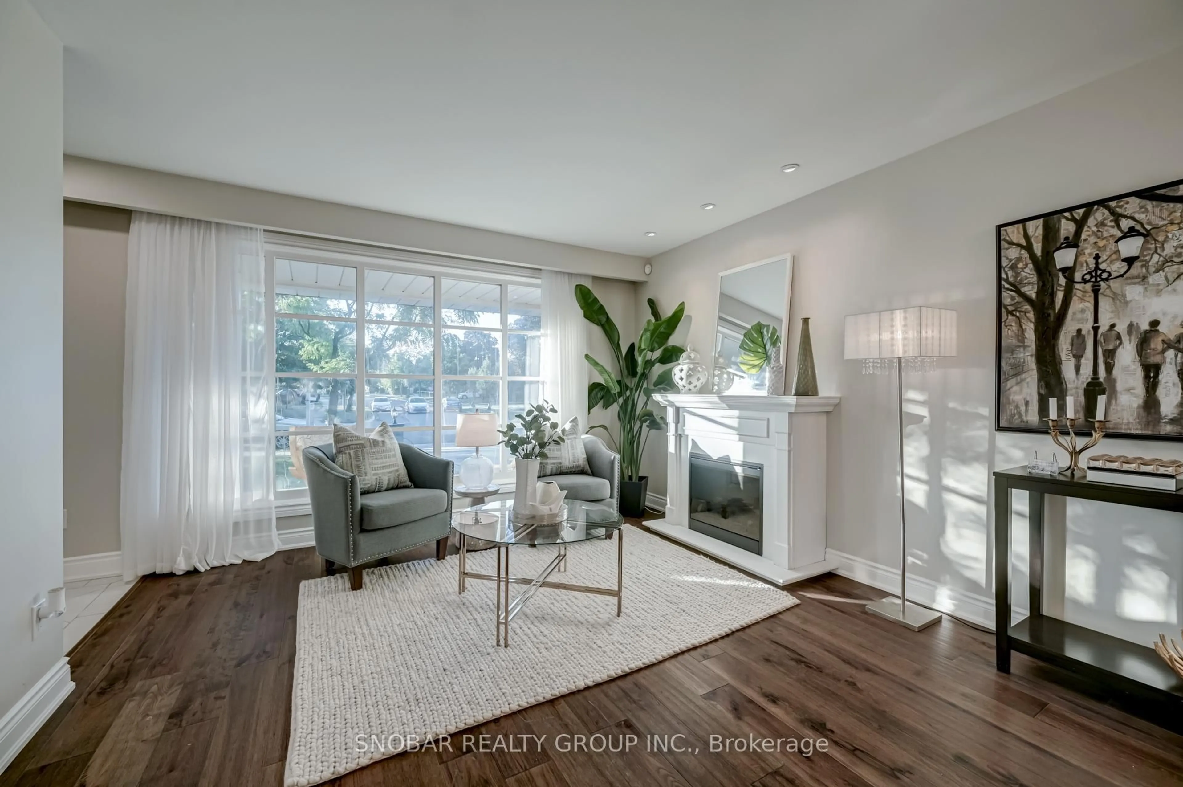 Living room with furniture, wood/laminate floor for 1242 Forestwood Dr, Mississauga Ontario L5C 1J1