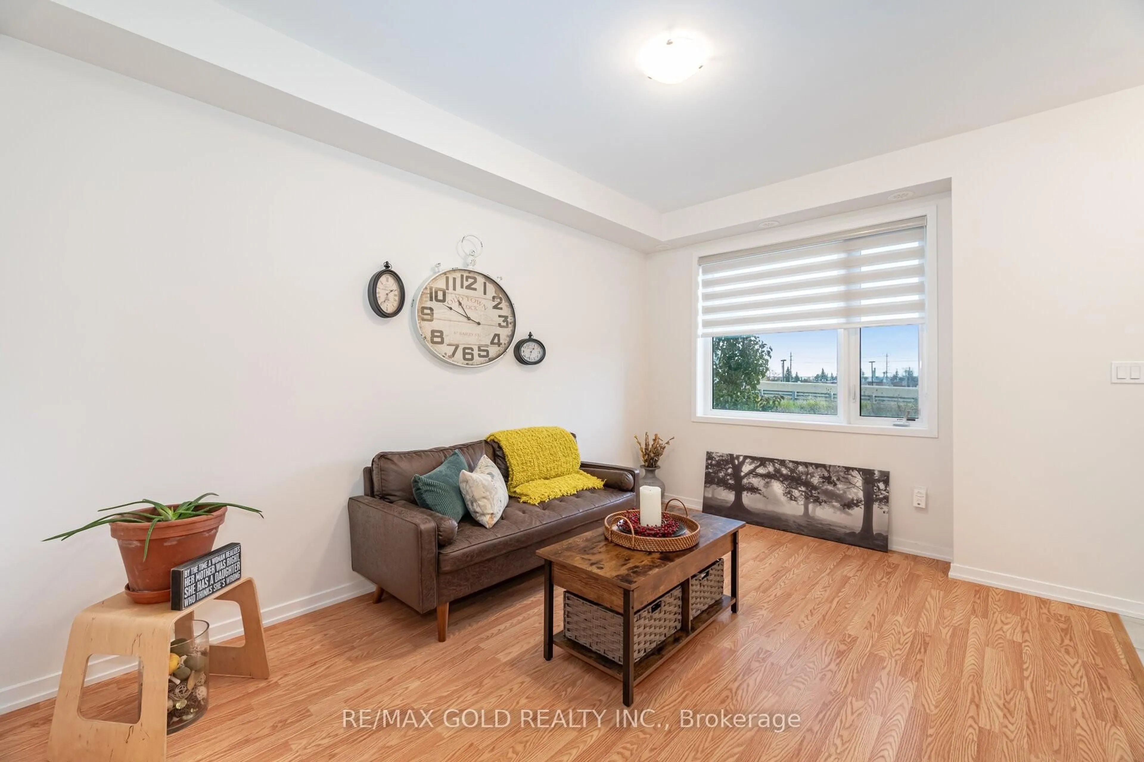 Living room with furniture, wood/laminate floor for 56 Lambert Lane, Caledon Ontario L7E 4M5