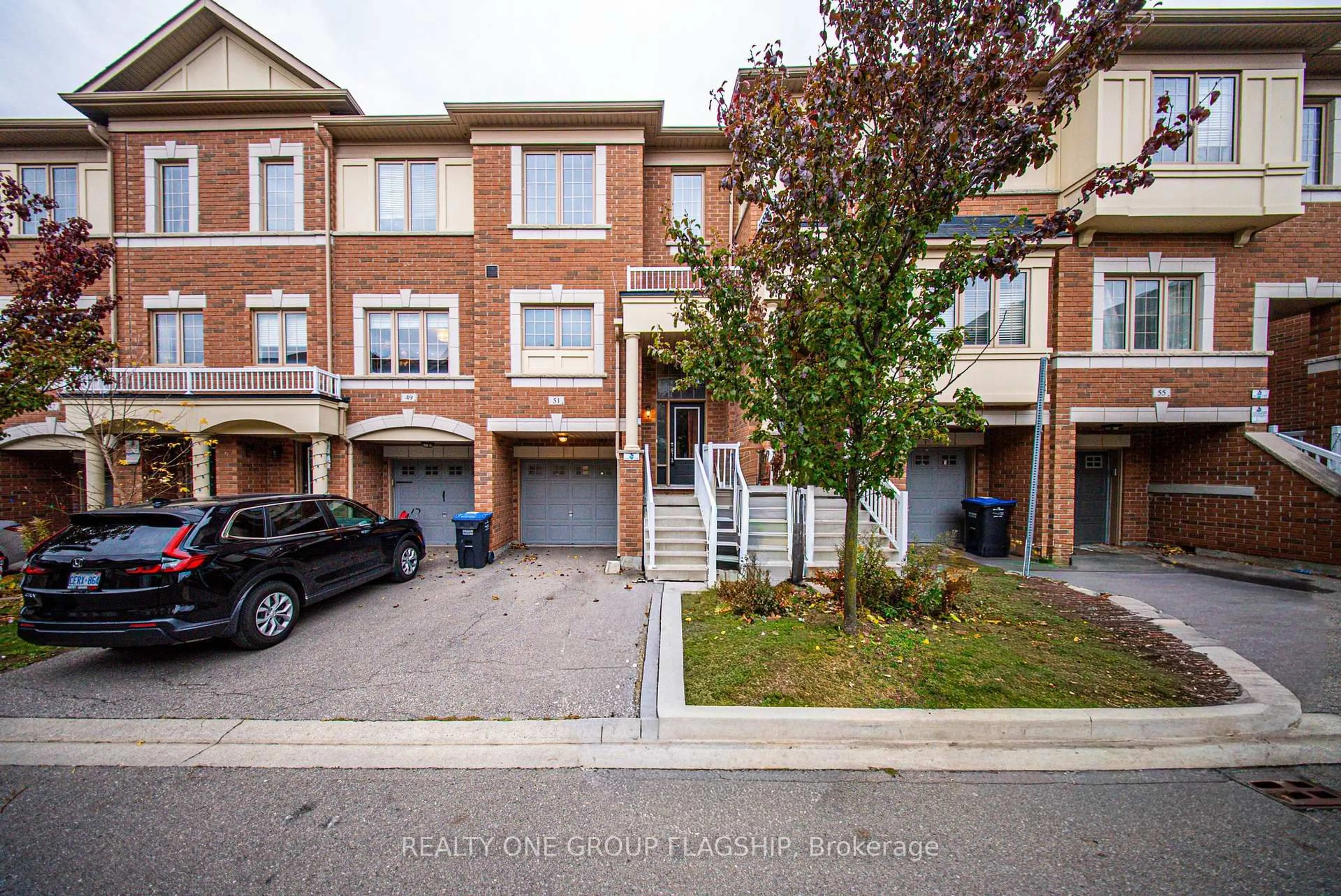 A pic from outside/outdoor area/front of a property/back of a property/a pic from drone, street for 51 Aspen Hills Rd, Brampton Ontario L6Y 6E4