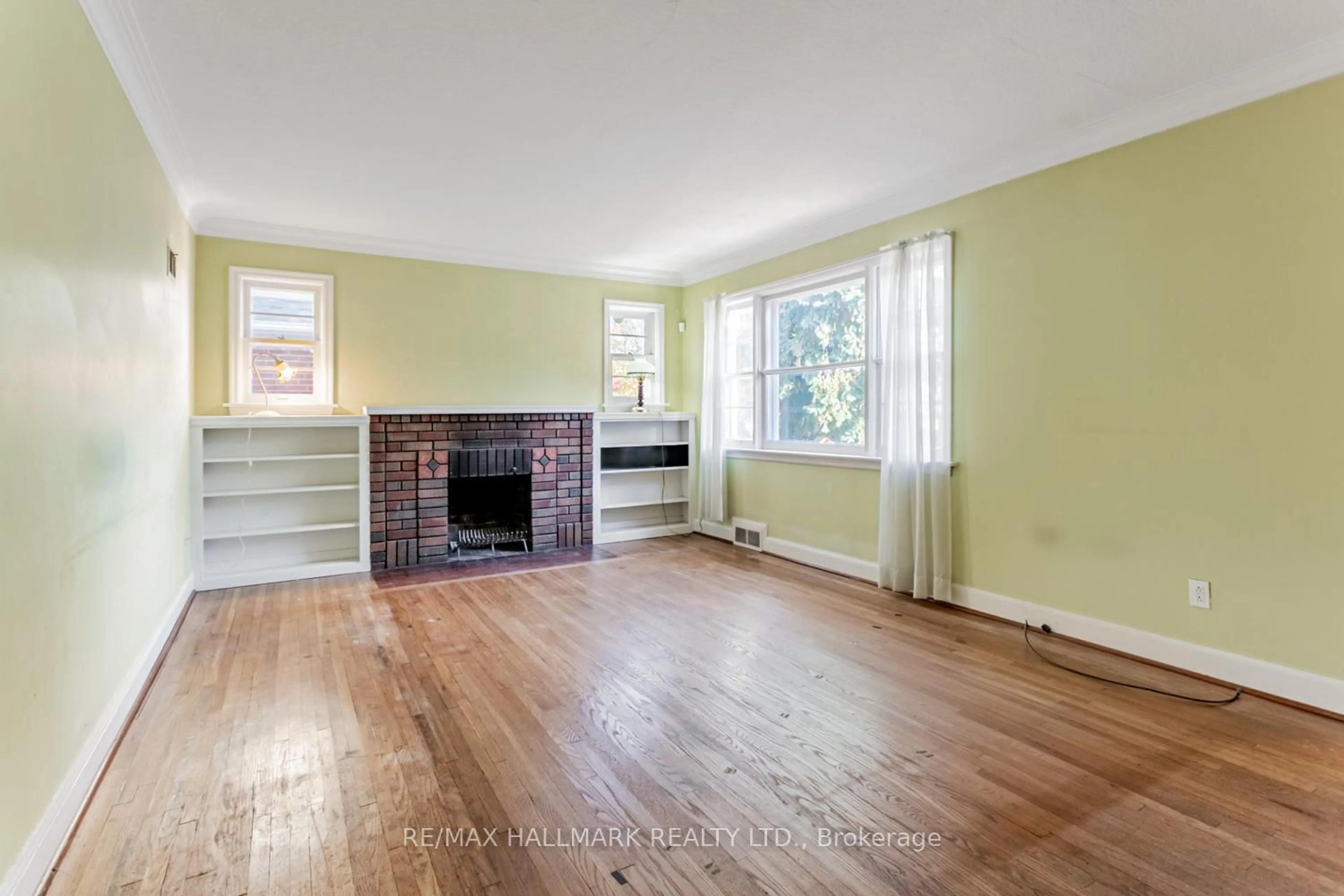 Living room with furniture, wood/laminate floor for 56 Delroy Dr, Toronto Ontario M8Y 1N2