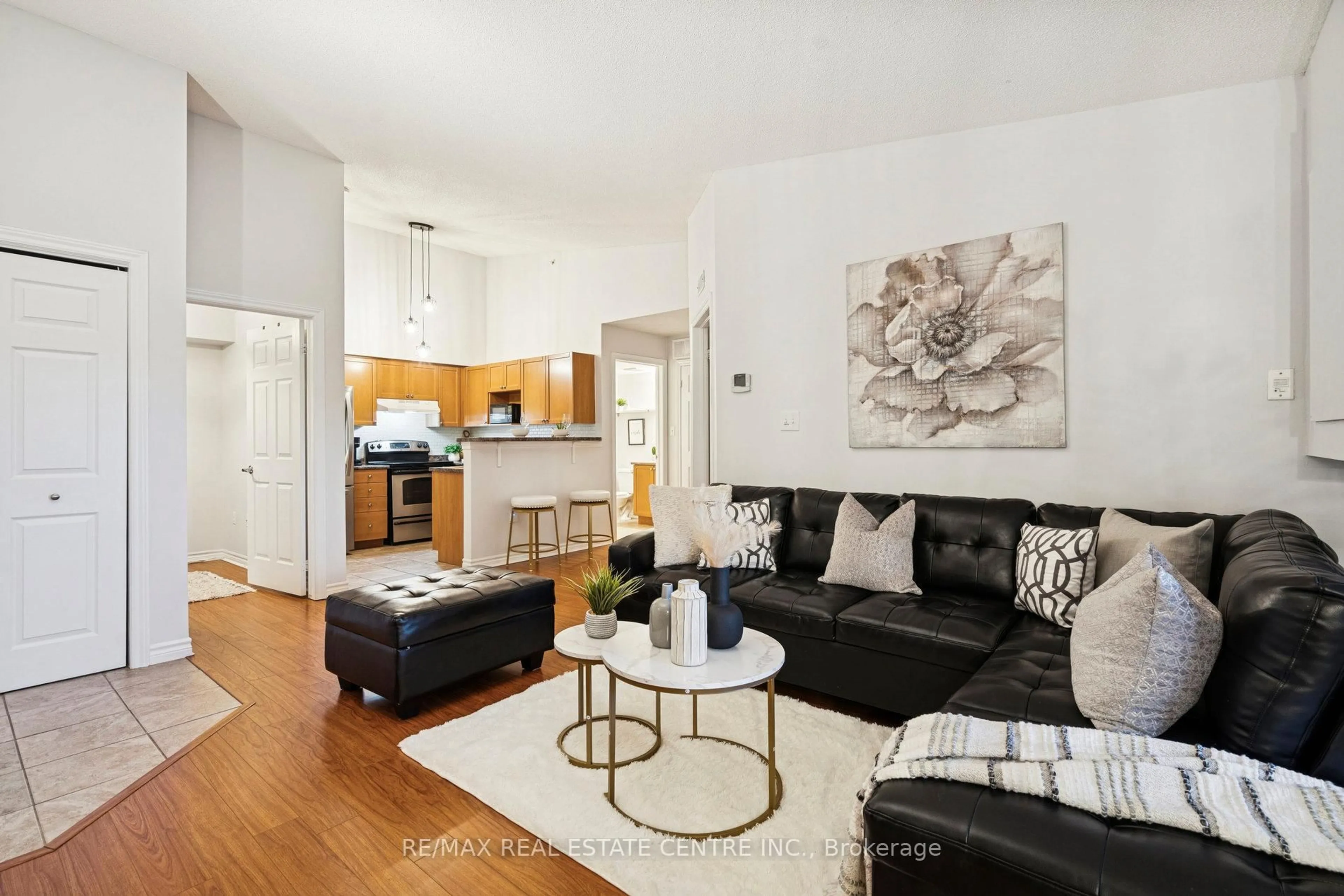 Living room with furniture, unknown for 1350 Main St #408, Milton Ontario L9T 7S7