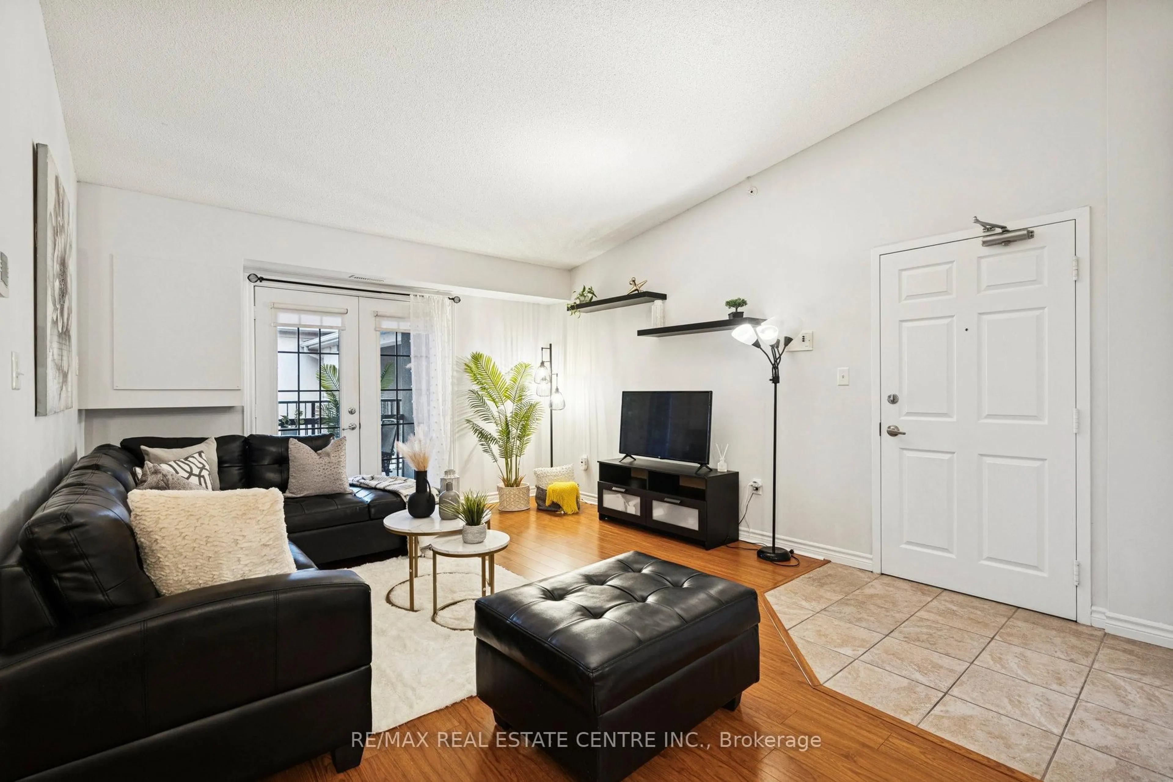 Living room with furniture, unknown for 1350 Main St #408, Milton Ontario L9T 7S7